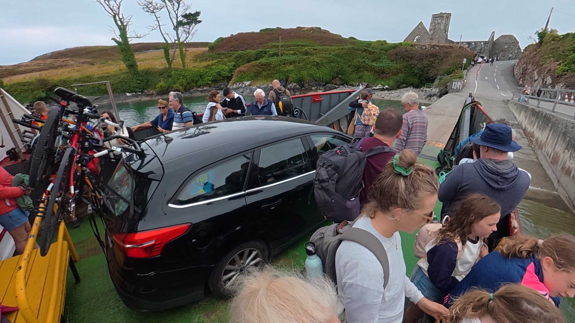 Car surrounded by passengers aboard the Sherkin Island ferry