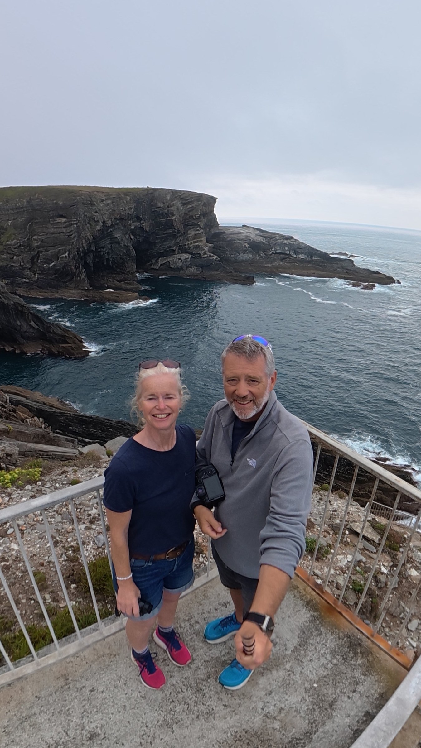 John and Sue taking a selfie above the rocky coast at Mizen Head