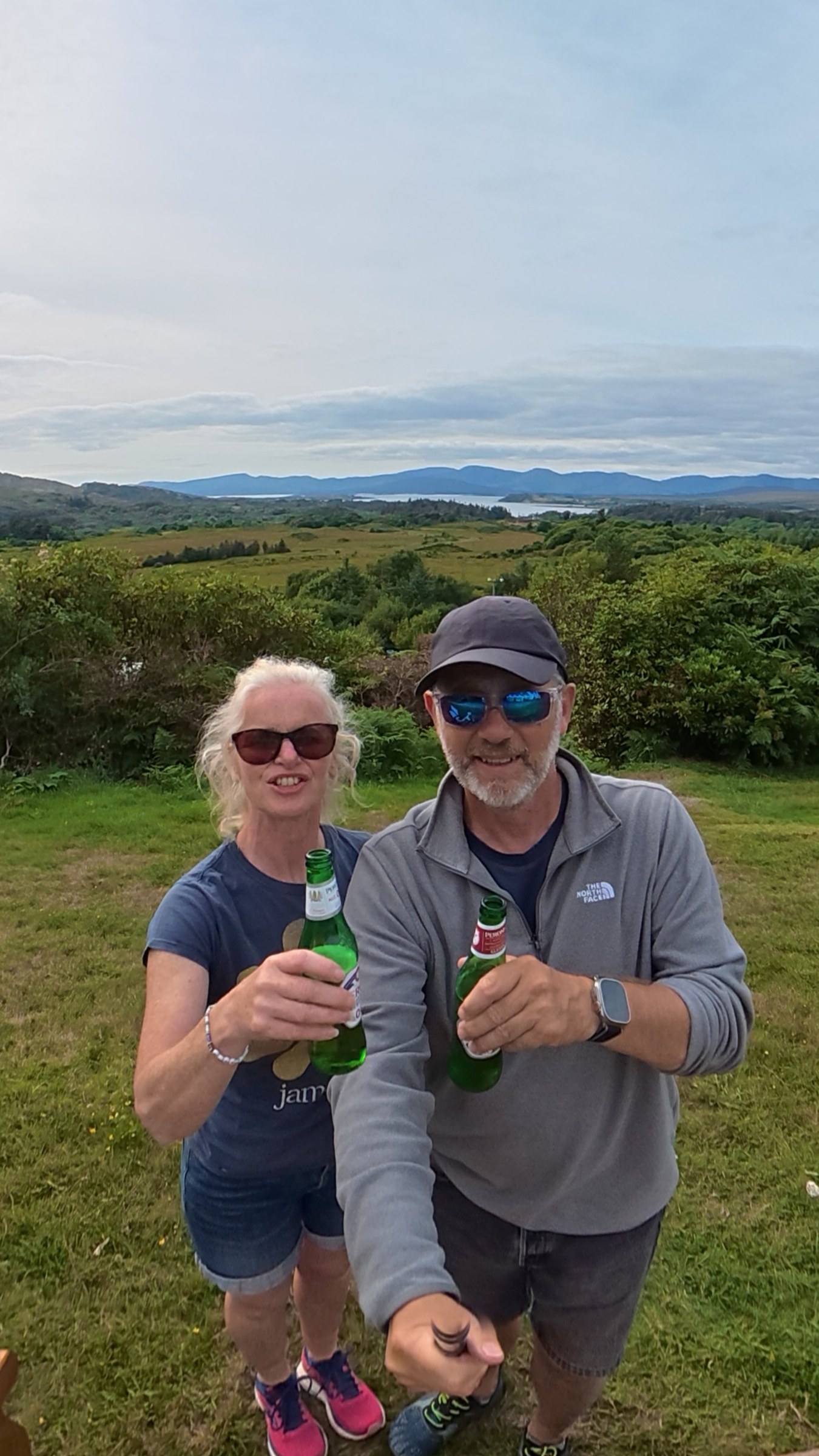 John and Sue raising drinks to a friend's birthday at Creveen Lodge