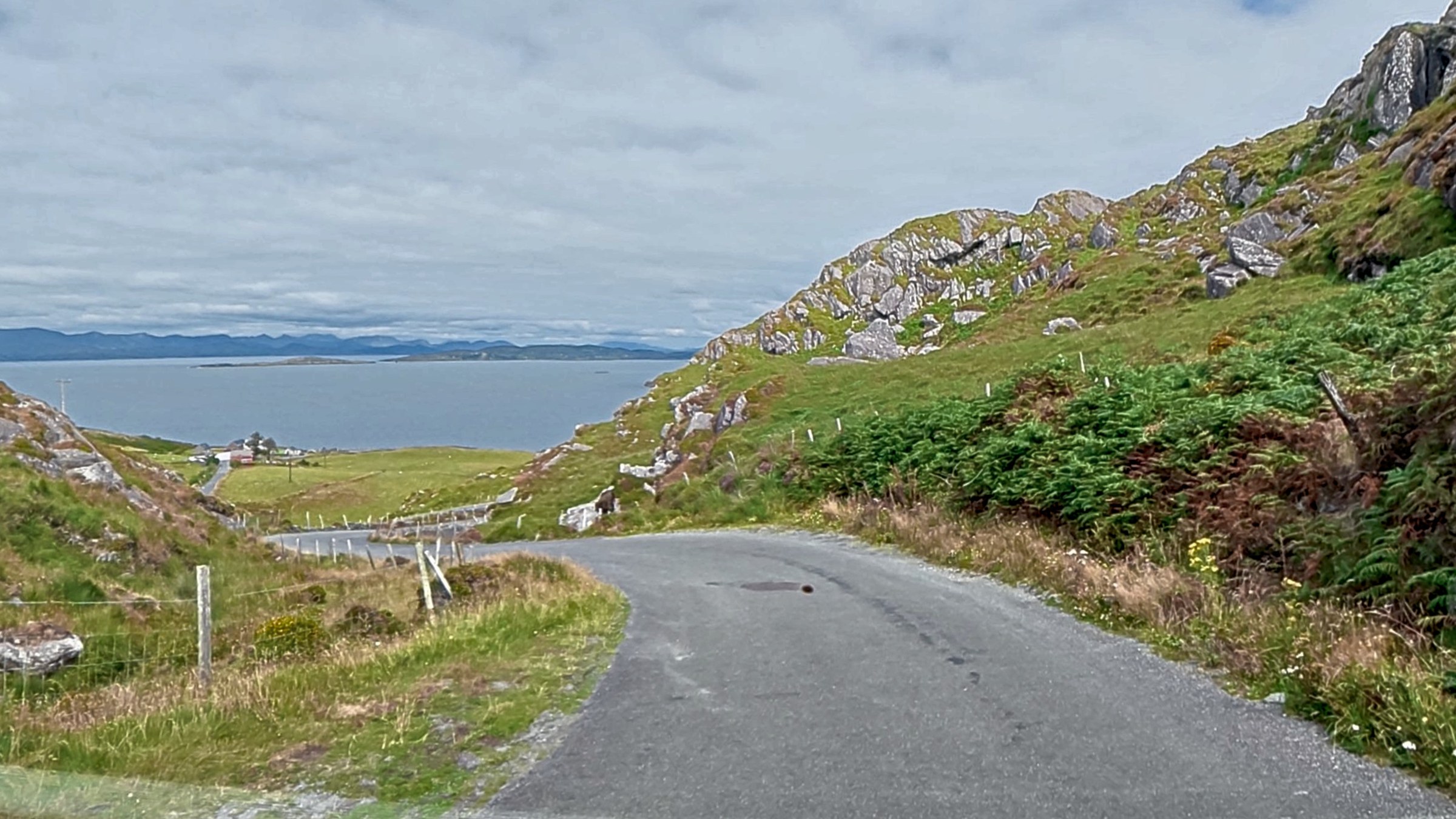The narrow road descending towards the coast on the Beara Peninsula