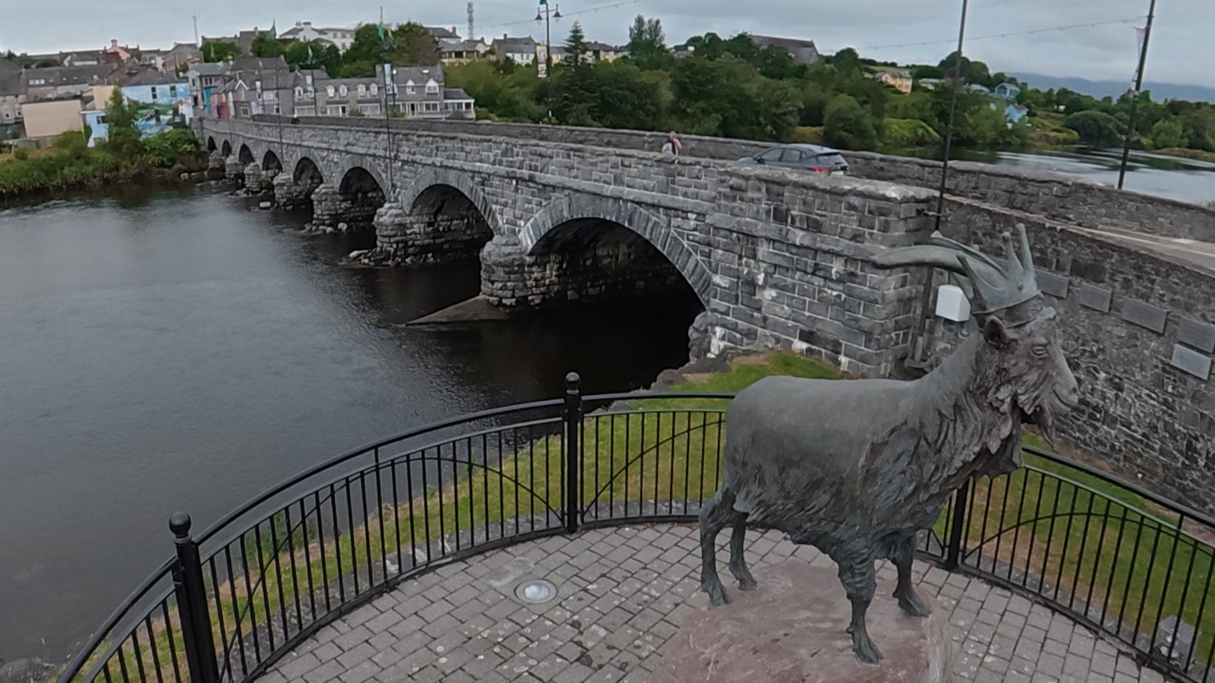Killorglin's eight-arch bridge with the King Puck goat statue in the foreground