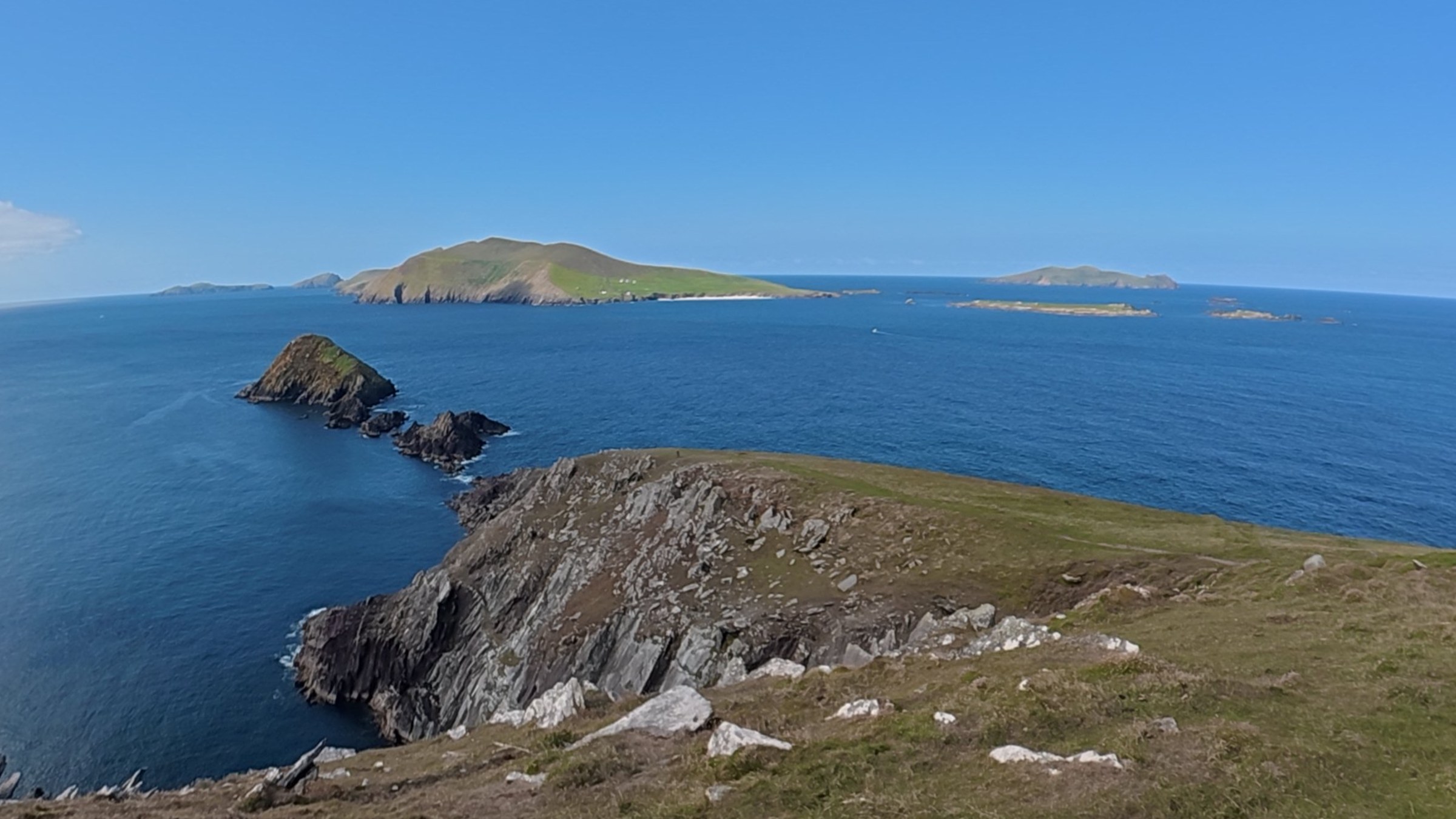 A wide view over the cliffs of Dunmore Head and the Blasket Islands