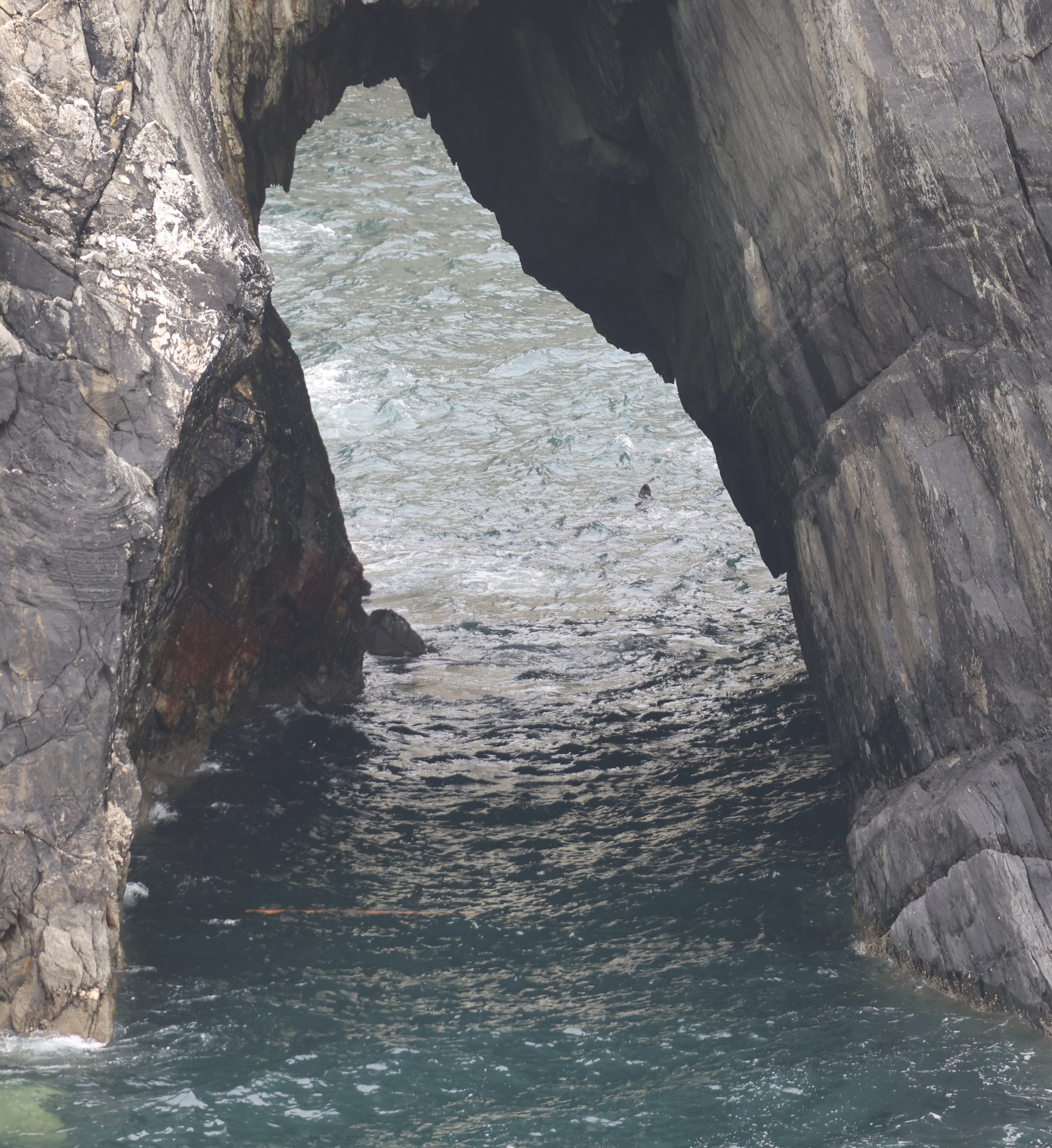 A natural sea arch in the cliffs at Mizen Head
