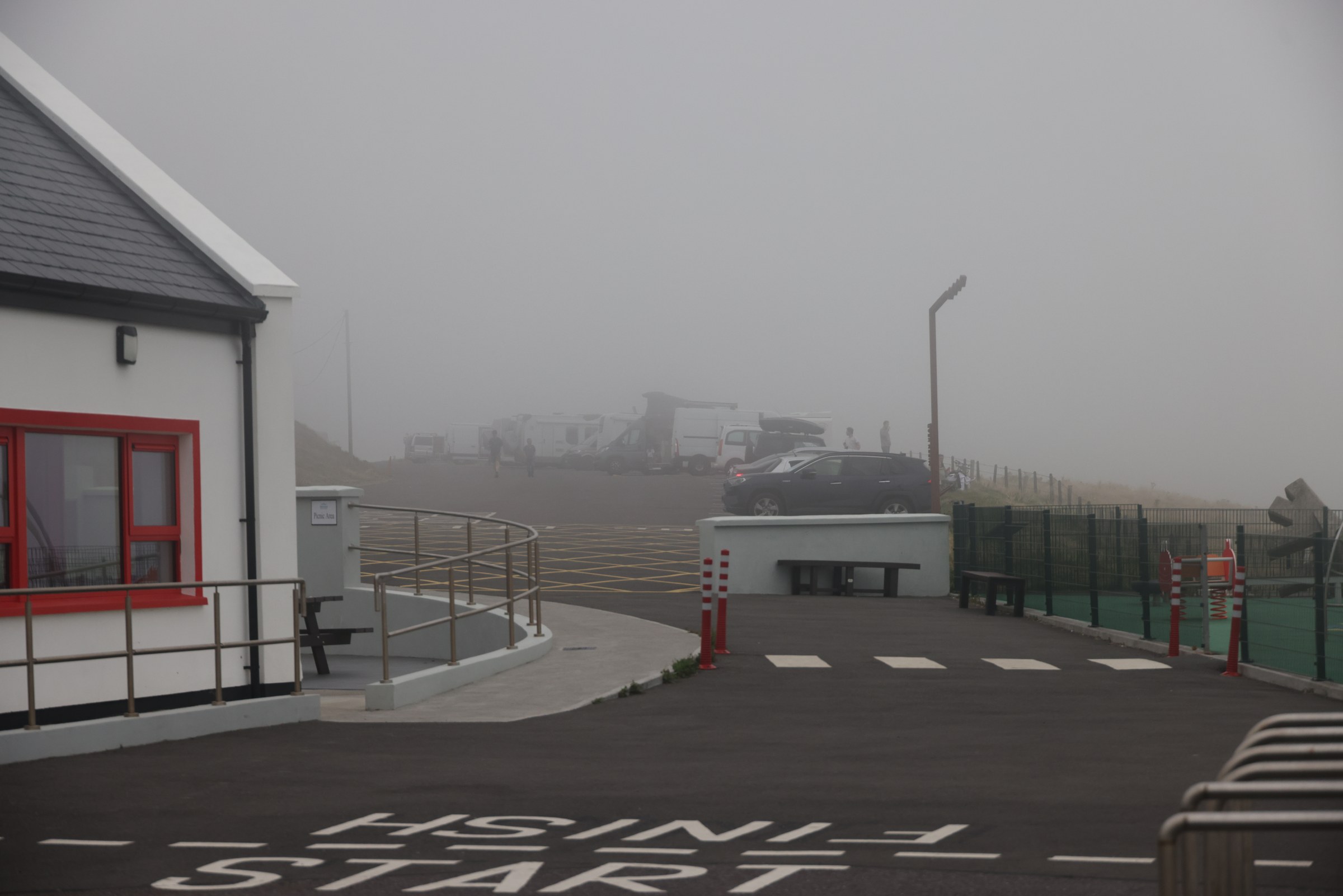 Mizen Head Visitor Centre and car park shrouded in fog