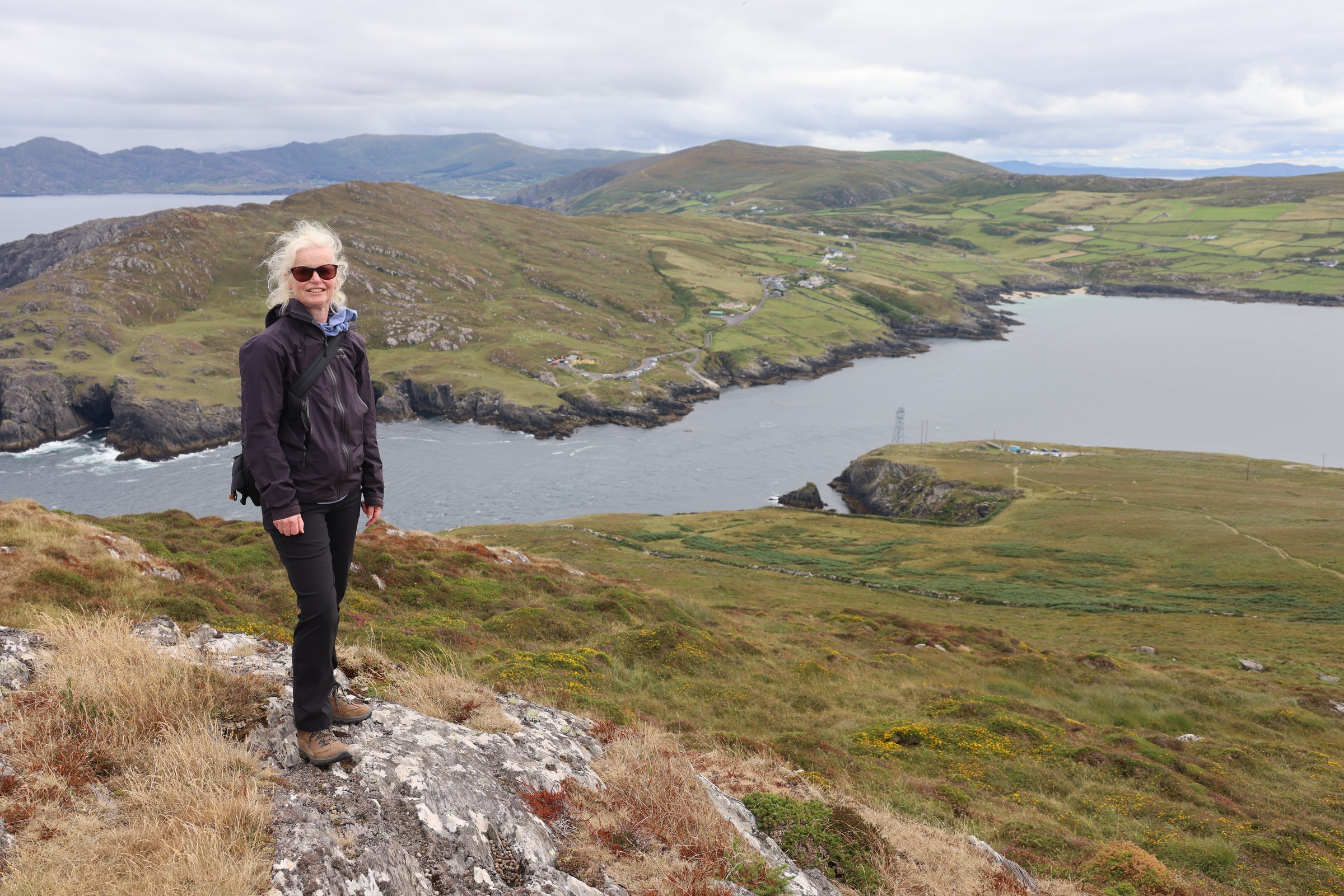 Sue standing above Dursey Sound with the Beara Peninsula beyond