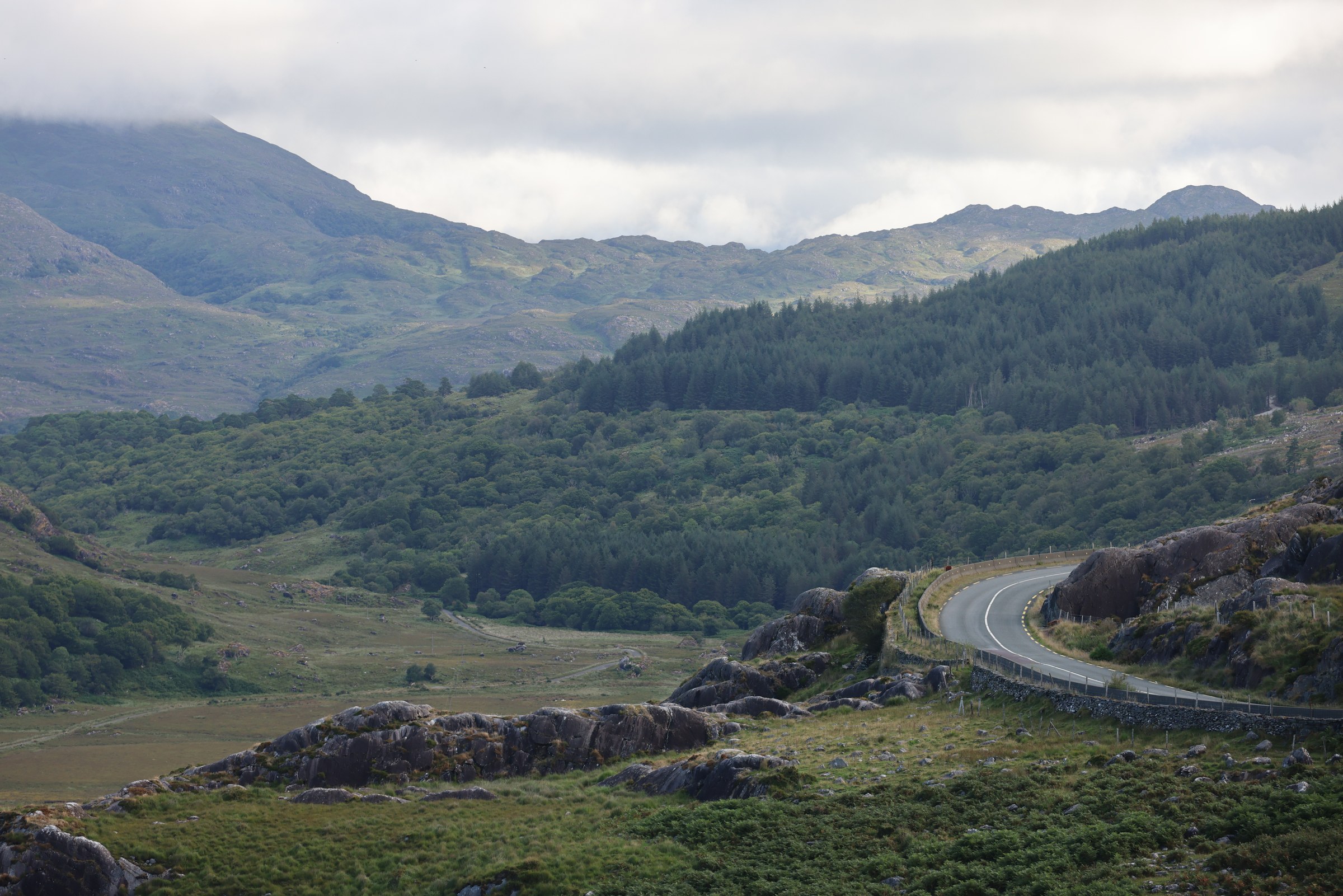 The winding N71 descending through green mountains from Moll's Gap
