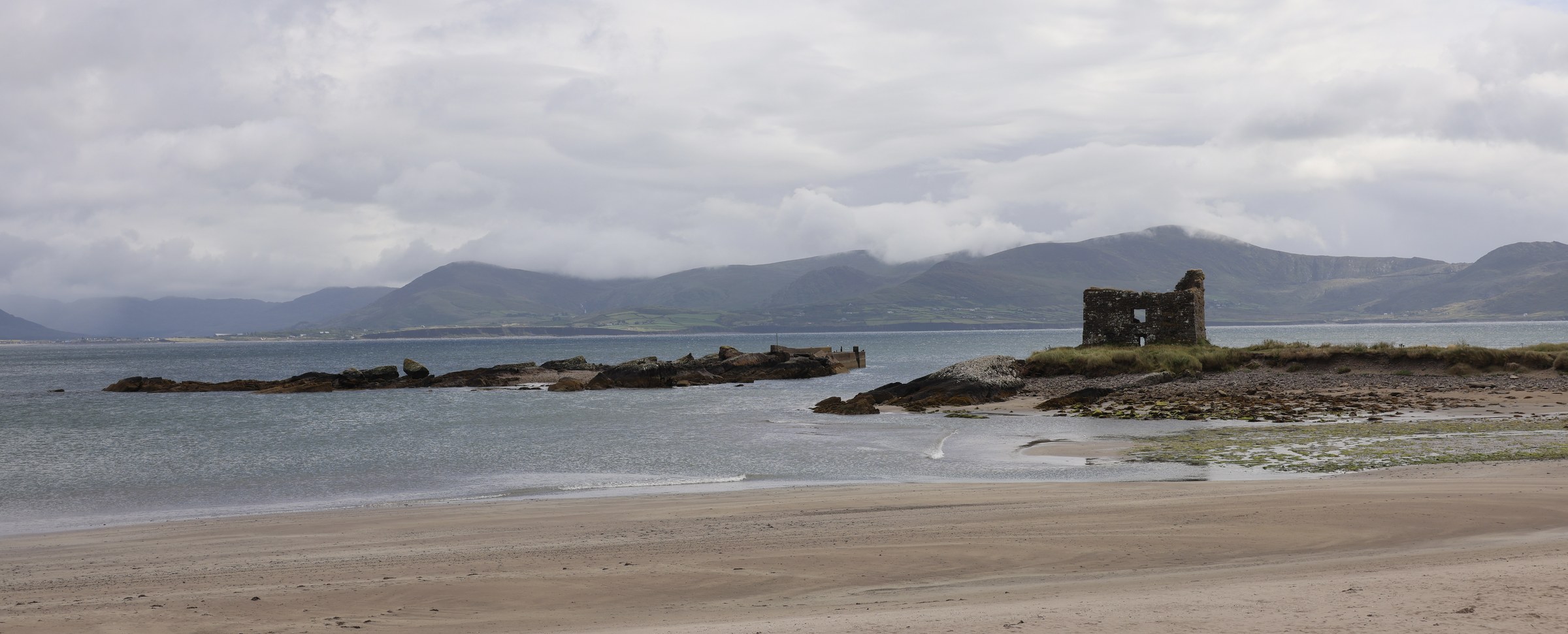 Ballinskelligs Beach with castle ruins across the water