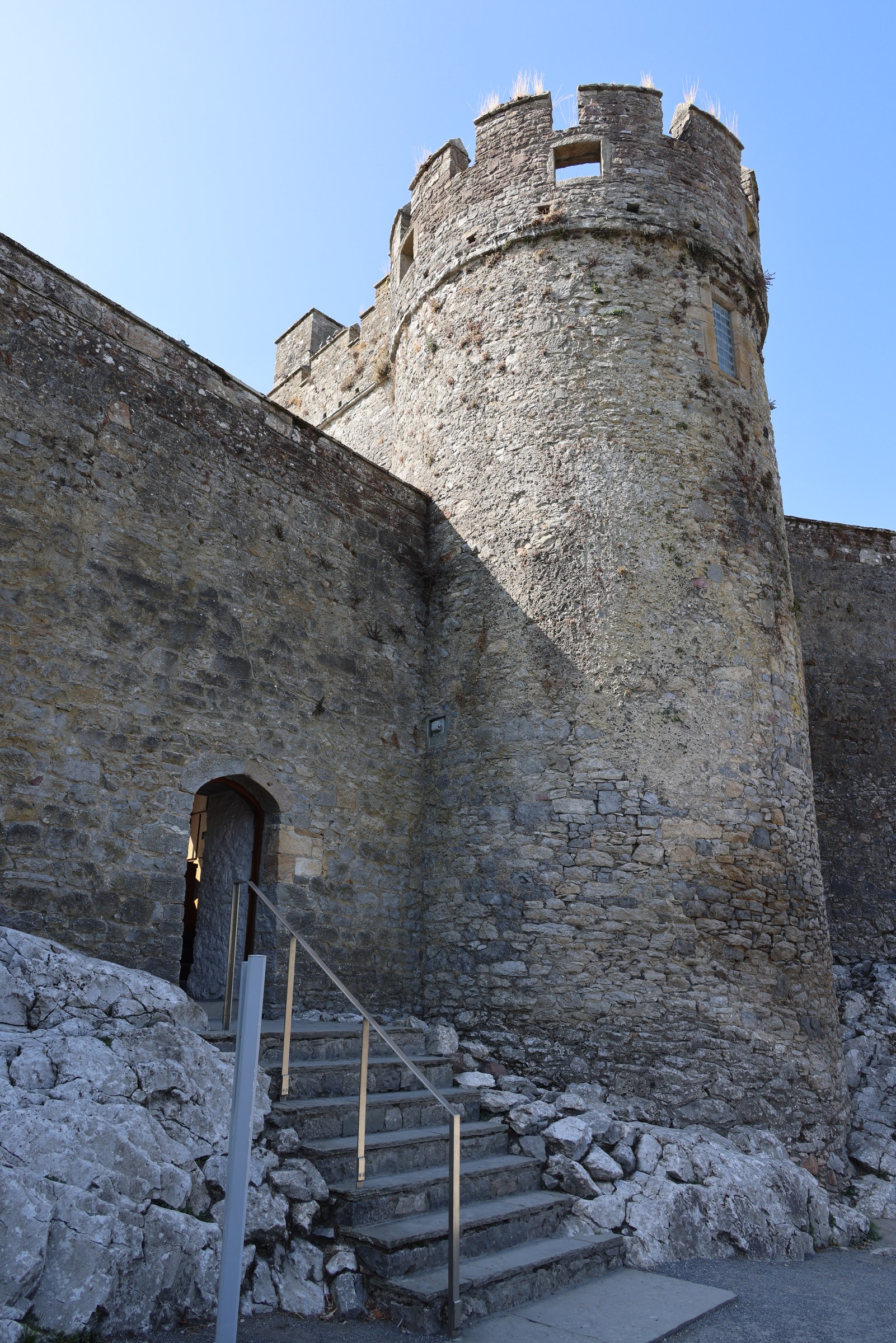 A round stone tower rising above the entrance to Cahir Castle