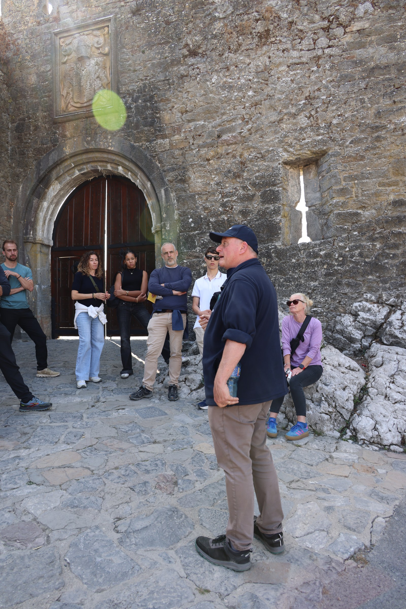 Tour guide Rob talking to visitors inside the entrance to Cahir Castle