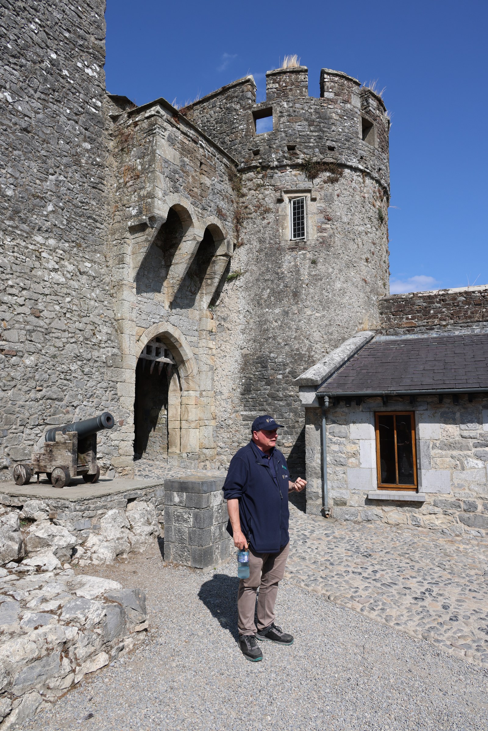 A stone tower and arched doorway inside Cahir Castle