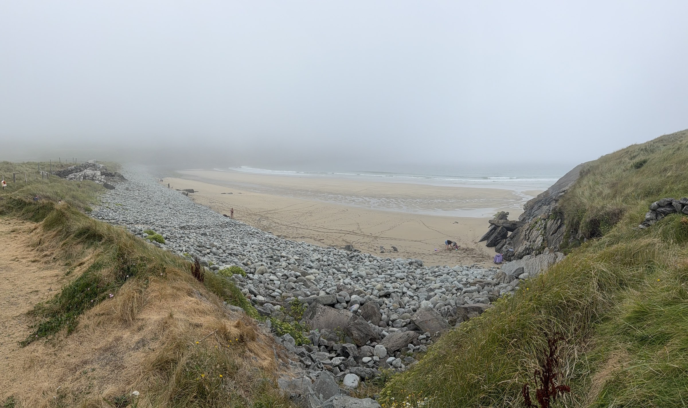 The misty beach viewed from the coast road