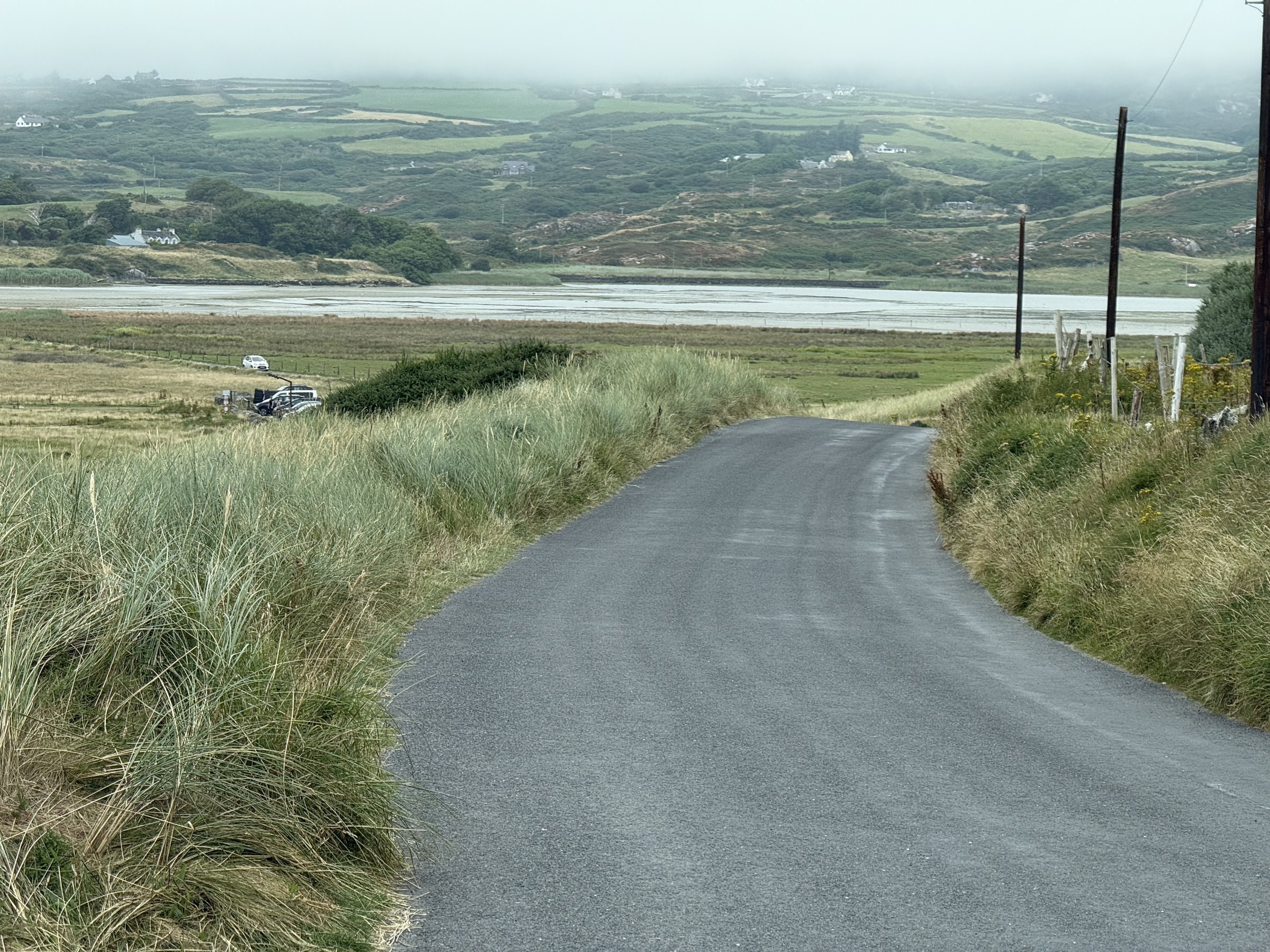 The narrow coast road descending towards the sea