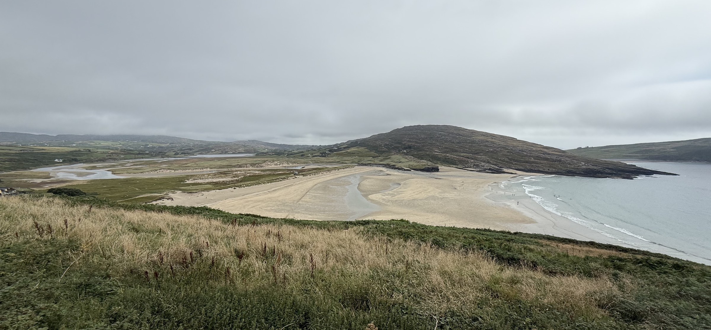 Barleycove's broad beach, dunes and lagoon beneath low cloud