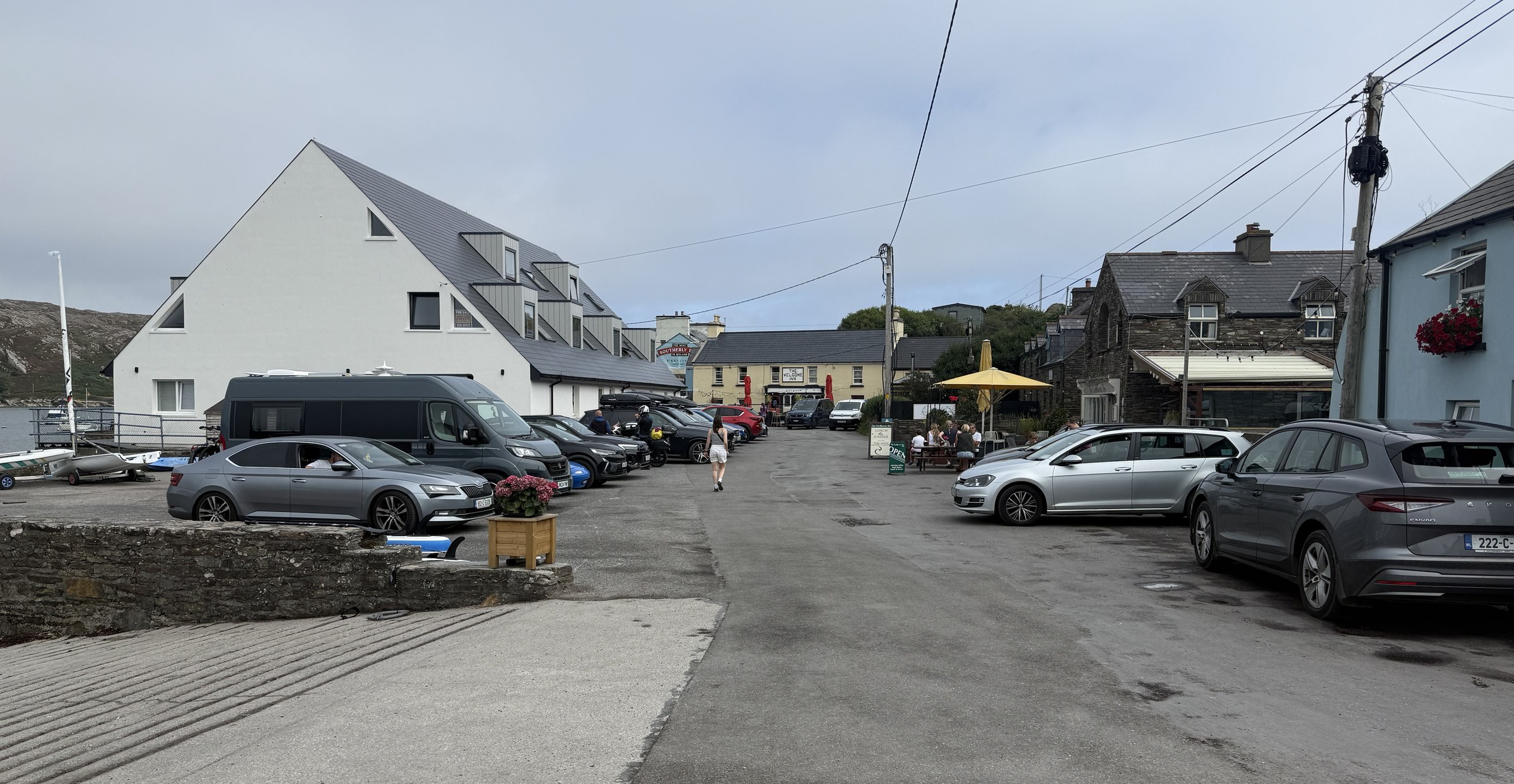 Cars, cafés and pubs along Crookhaven's compact harbourfront