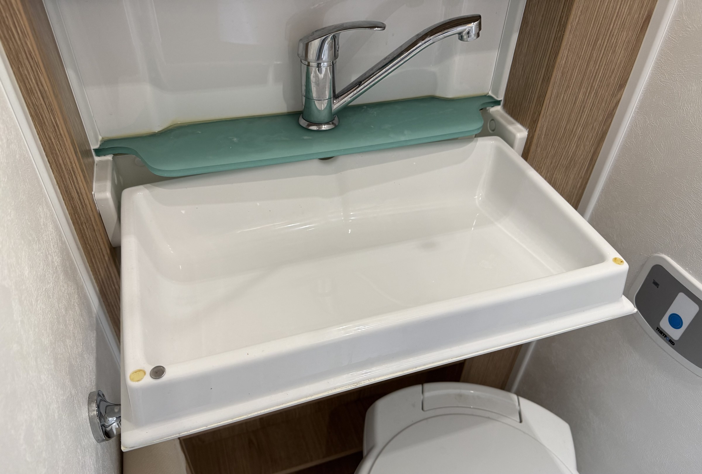 The fold-down sink in Ollie's wet room