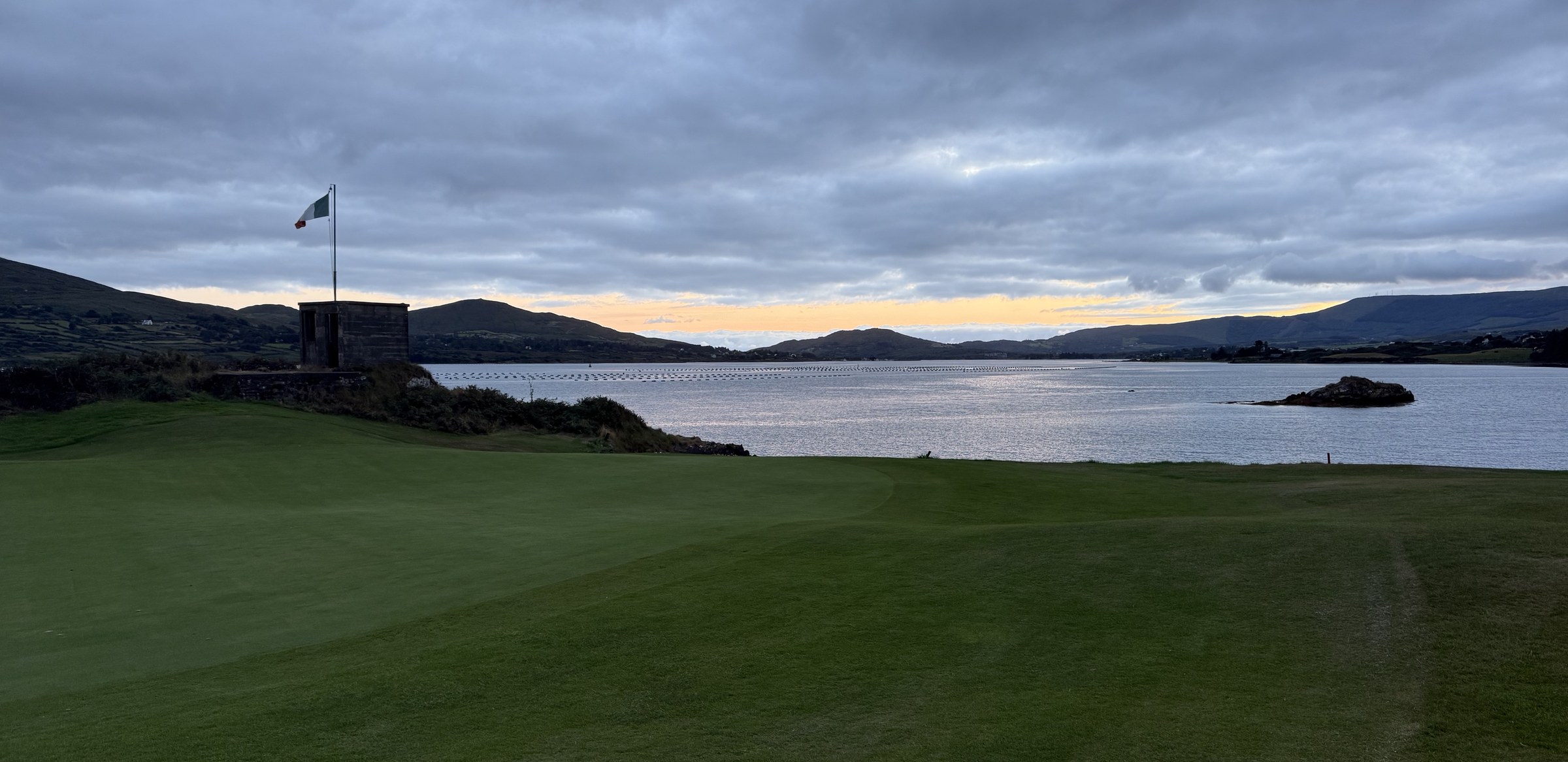 The golf course overlooking the islands and calm water of Berehaven Harbour