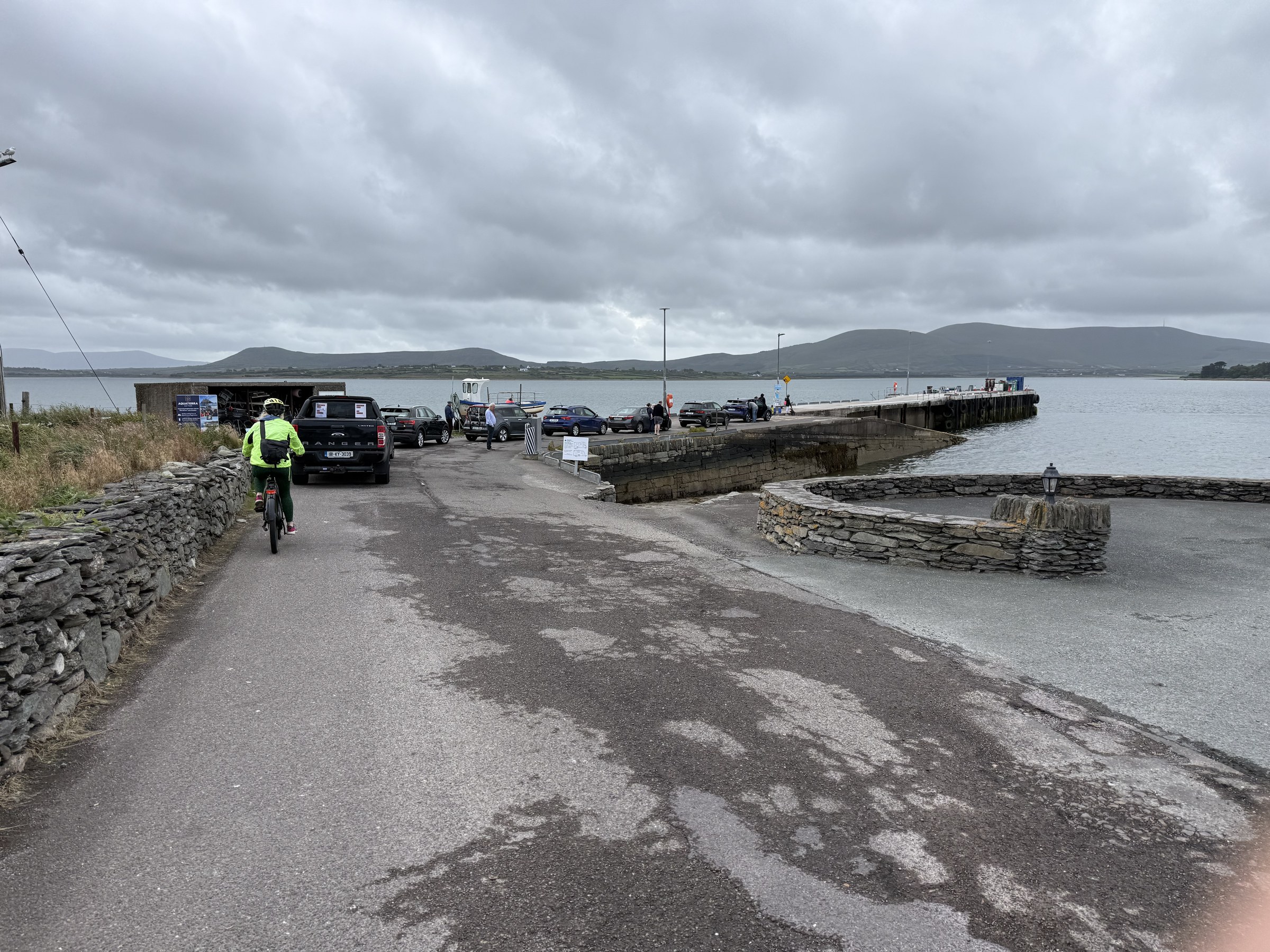 Sue cycling towards the ferry queue at Reenard Point