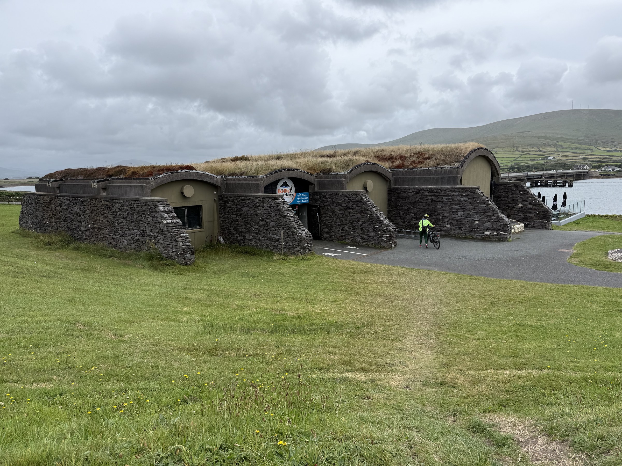 The turf-roofed Skellig Experience Visitor Centre beside Portmagee Channel