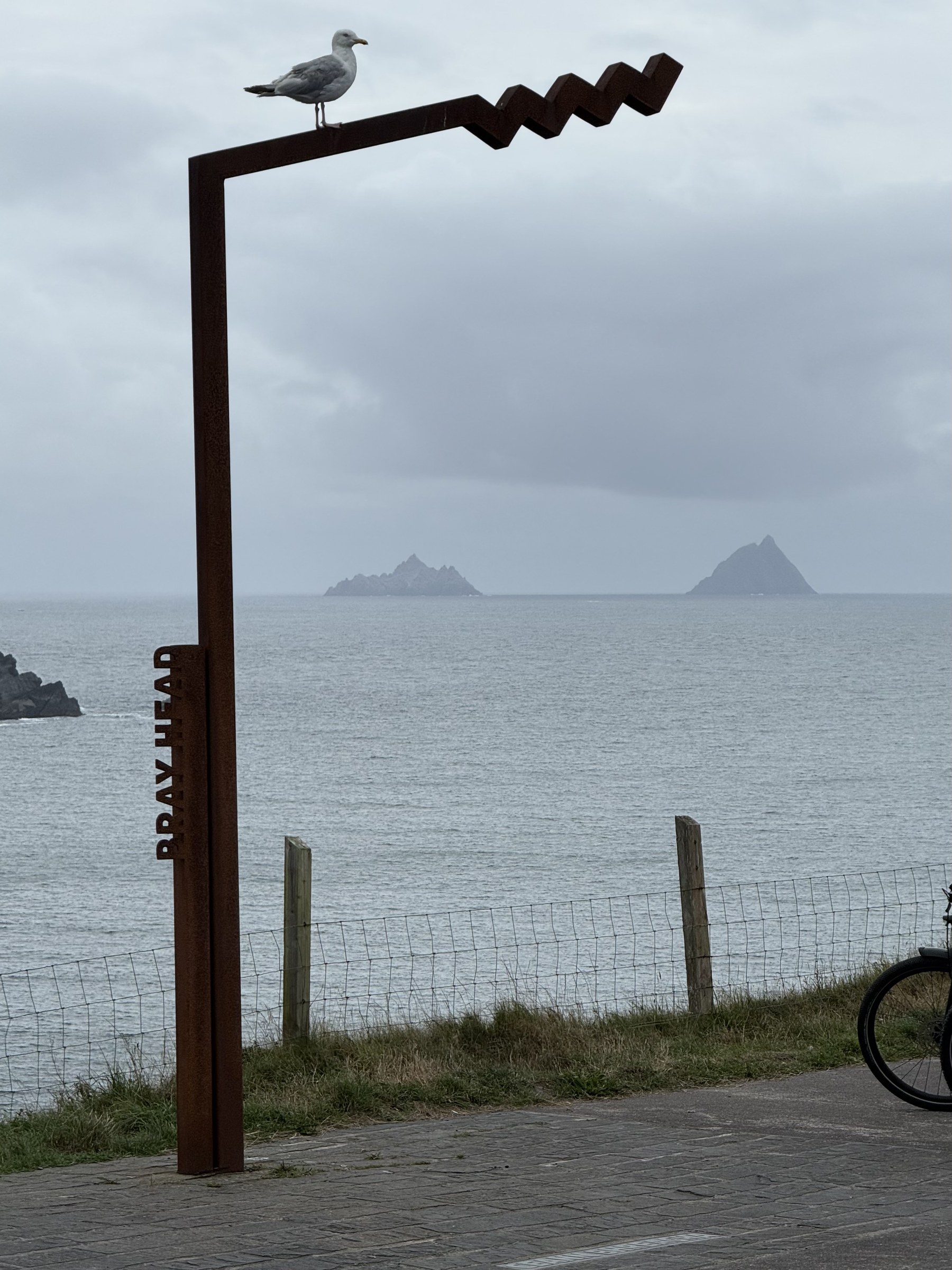 The Skellig Islands framed by the Bray Head viewpoint sculpture