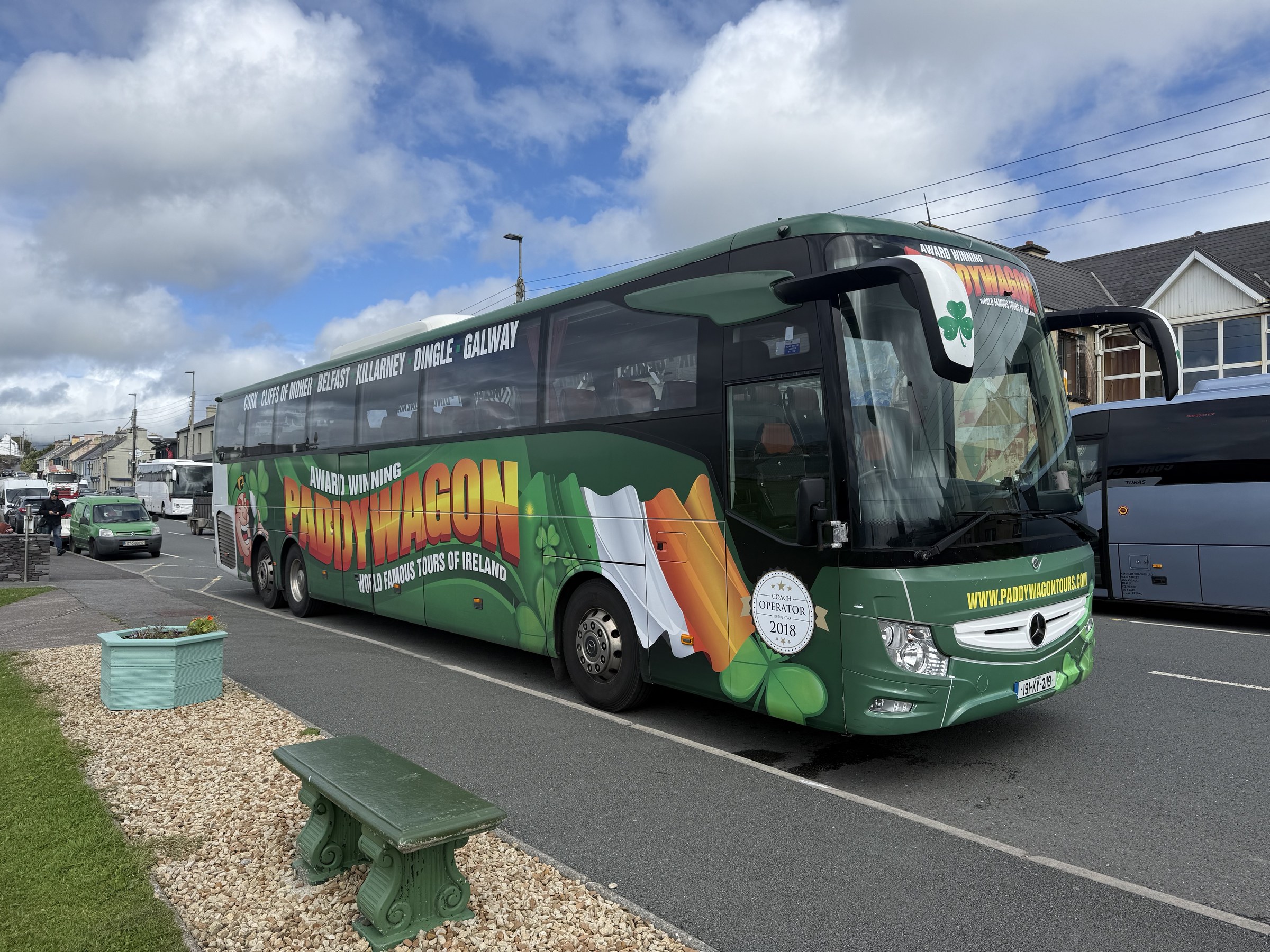 A green Paddywagon tour coach parked in Waterville