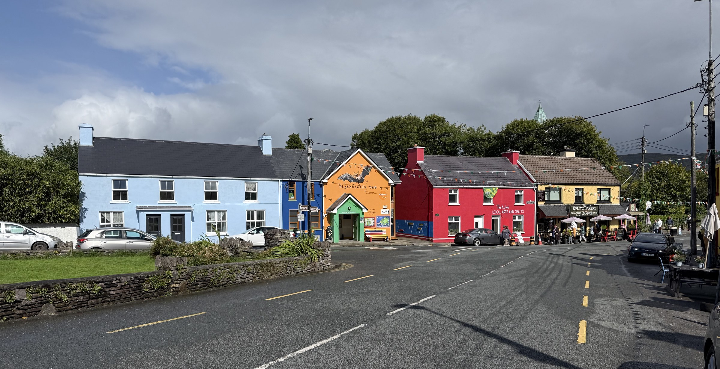 Brightly painted buildings lining the main street through Sneem