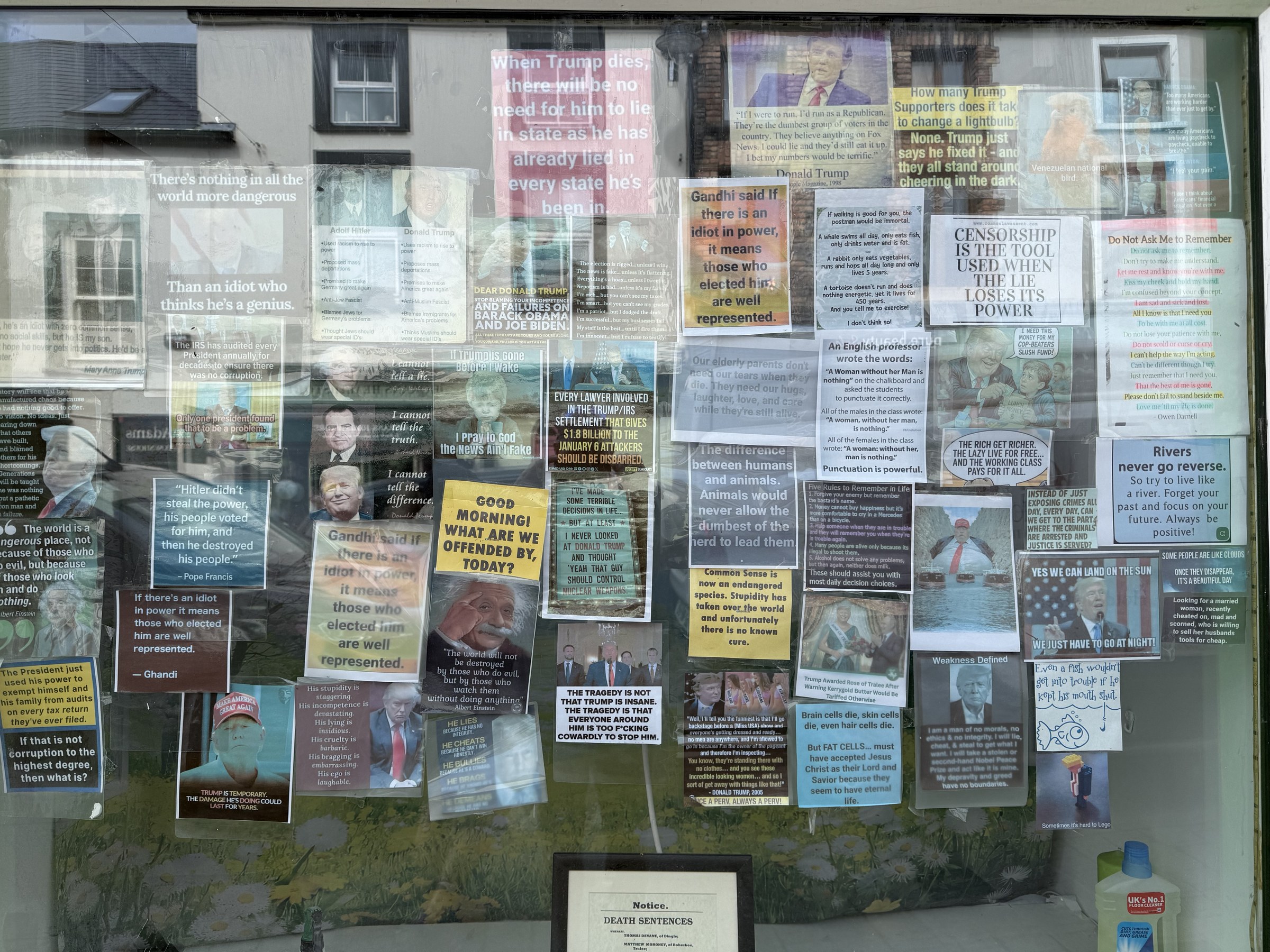 A Dingle shop window covered with anti-Trump jokes and political signs