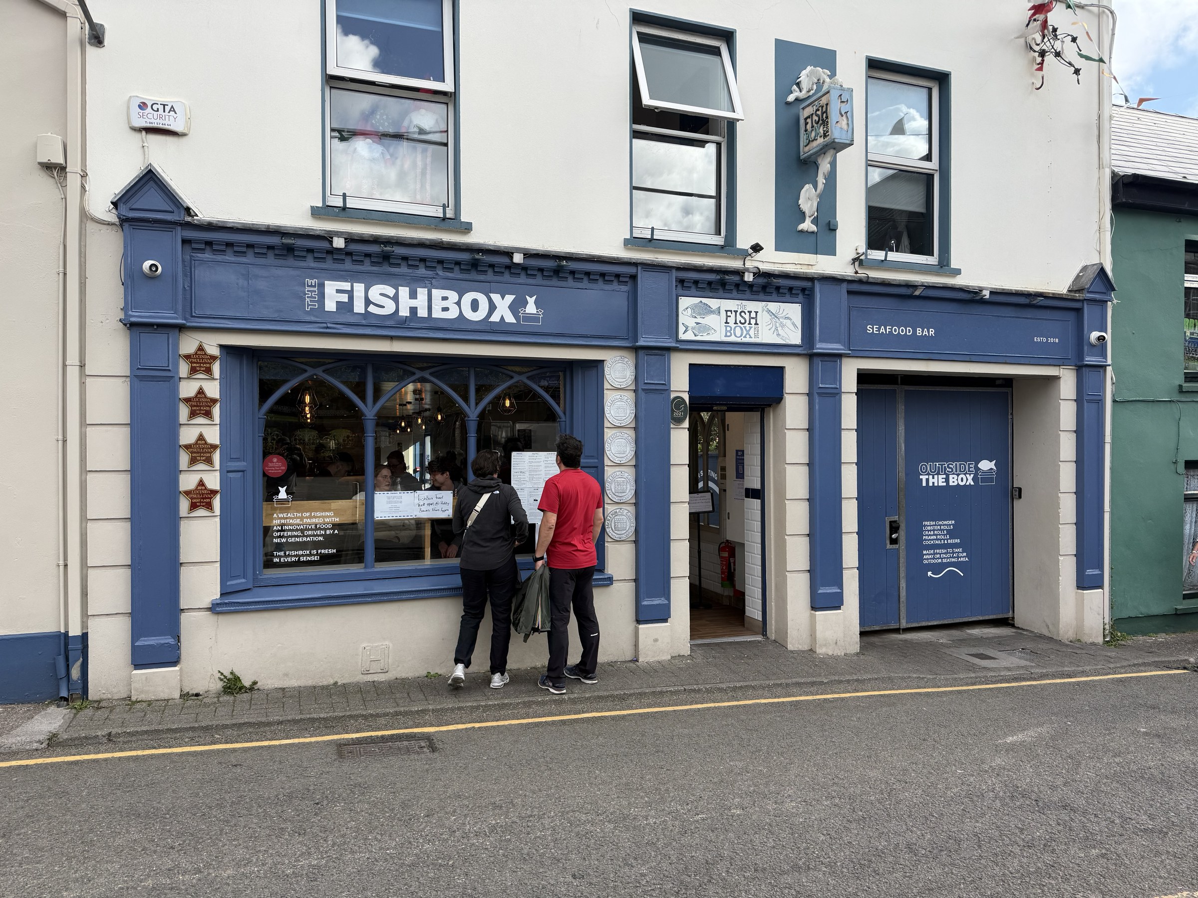 The blue frontage of The Fish Box restaurant in Dingle