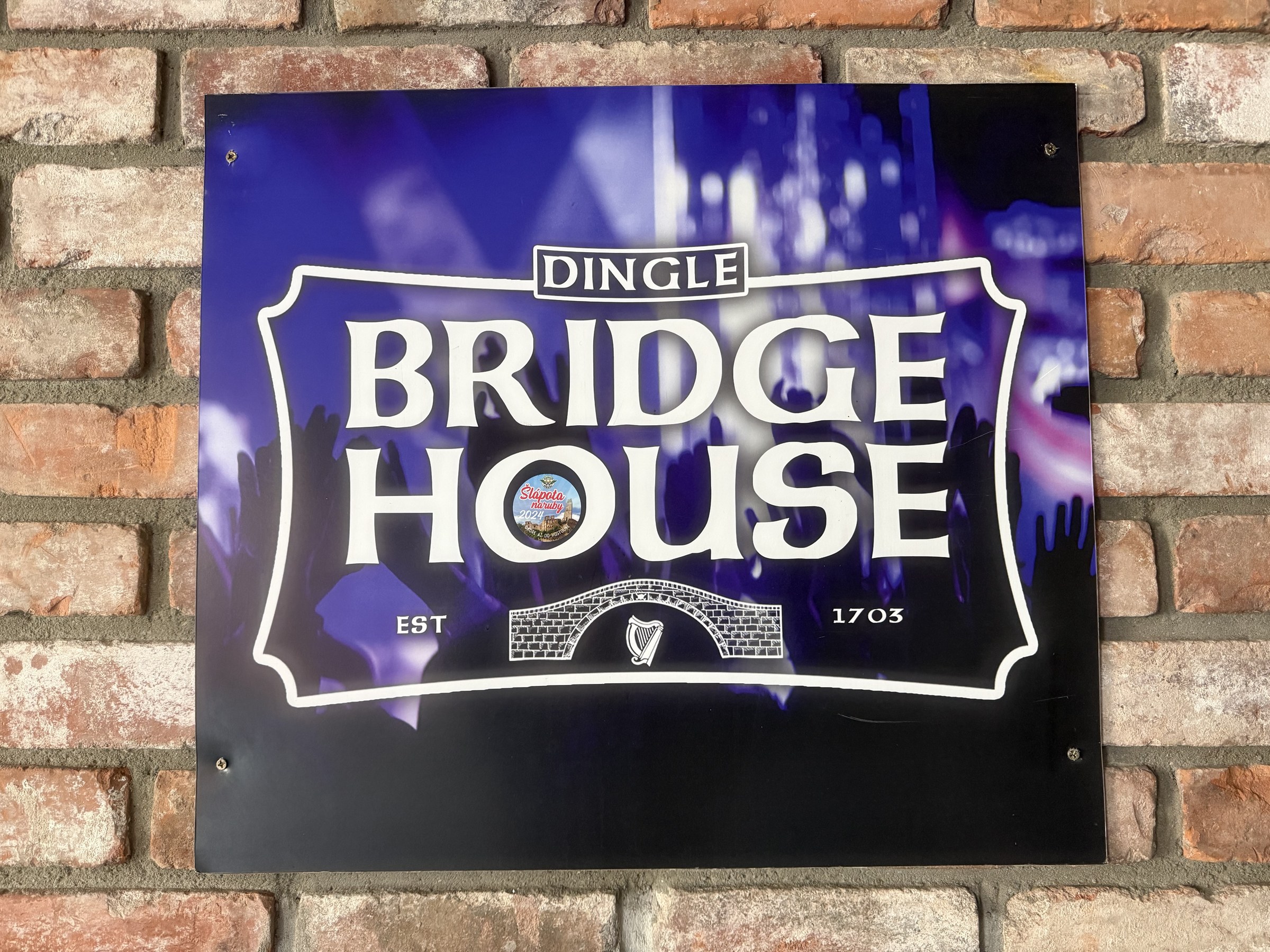 A sign for the Bridge House pub in Dingle showing its claimed 1703 date