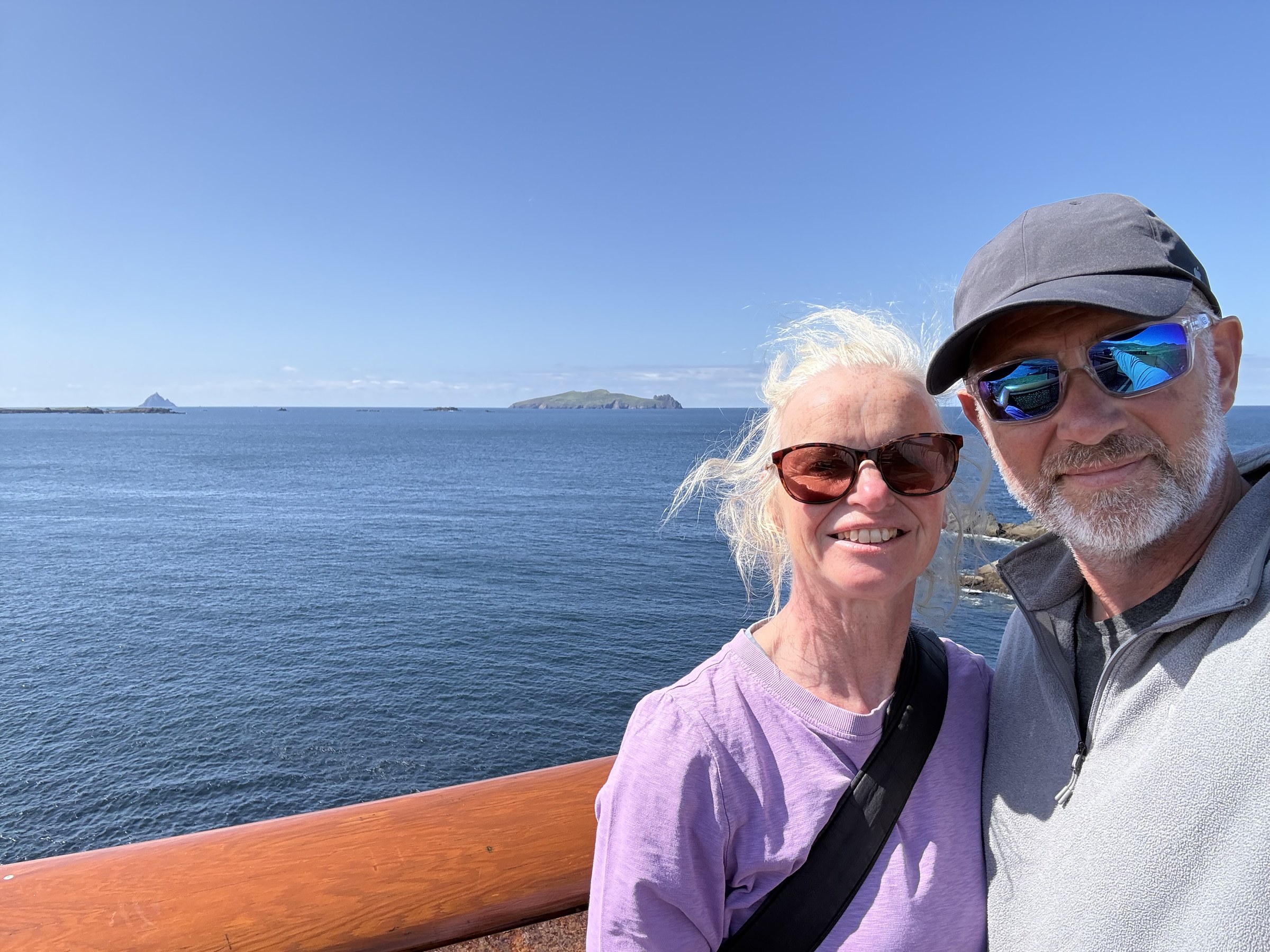 Sue and John on the viewing platform with the Blaskets behind