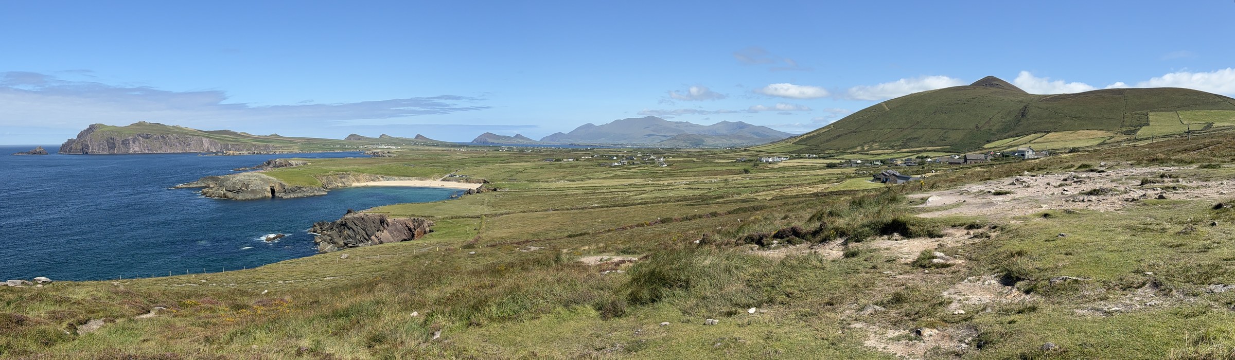 Clogher Beach, Ferriter's Cove and the Three Sisters beneath a clear sky