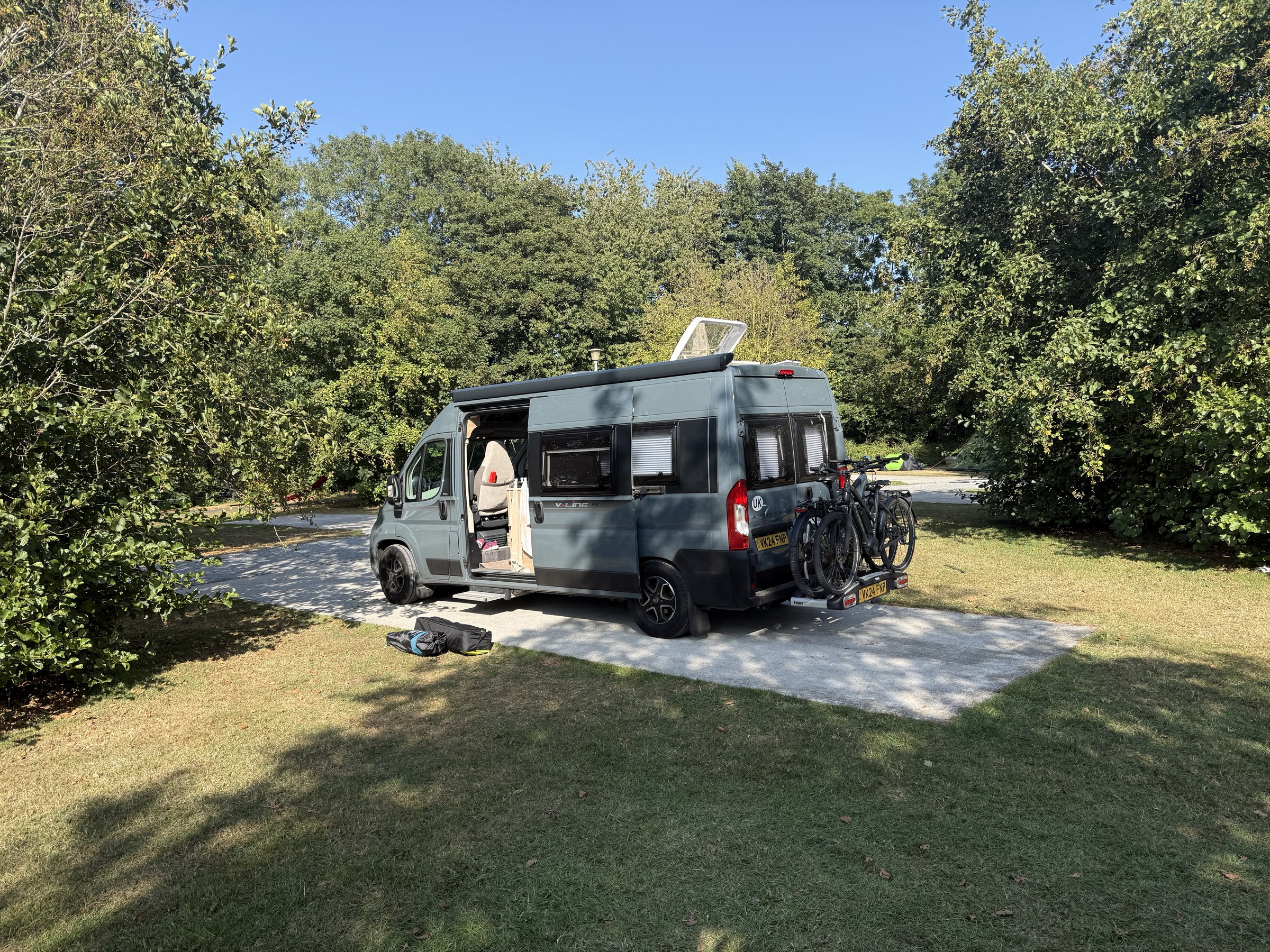 Ollie parked on a hardstanding pitch among the trees at the Apple Farm