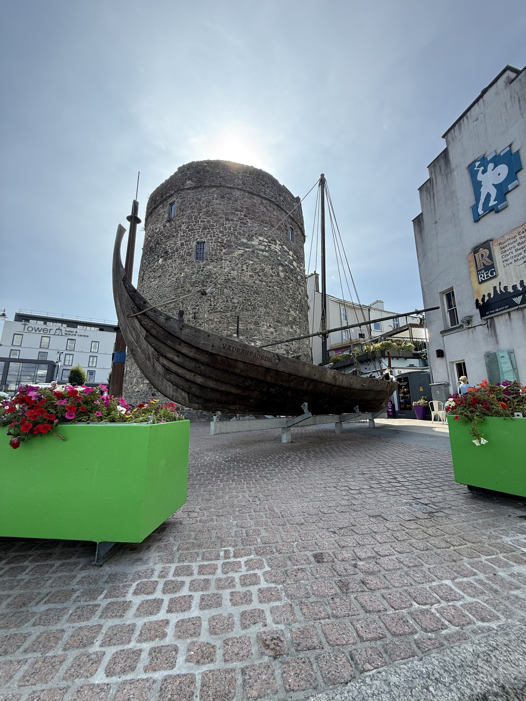 A replica Viking longboat displayed in front of Reginald's Tower