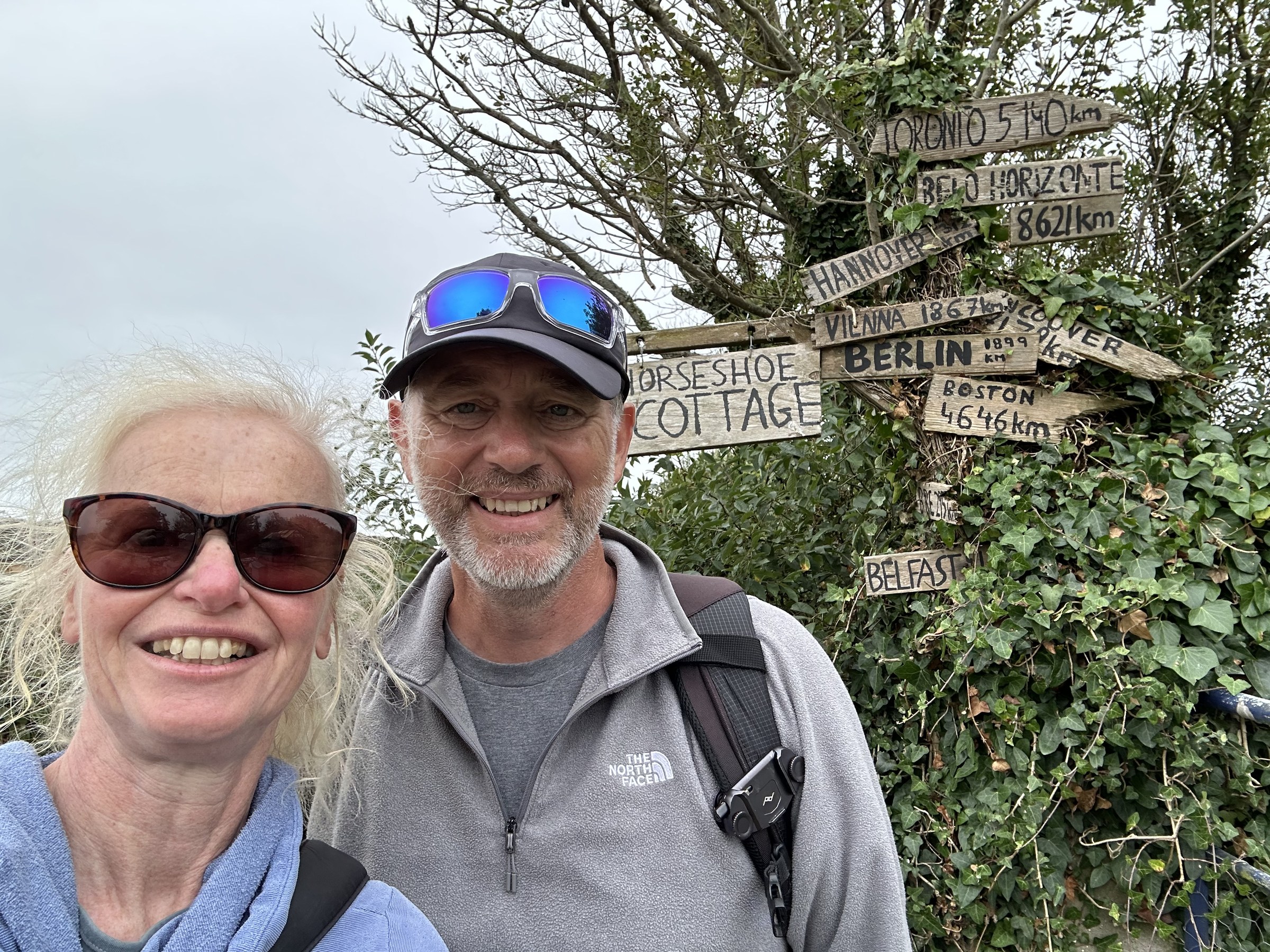 John and Sue beside a Sherkin Island signpost