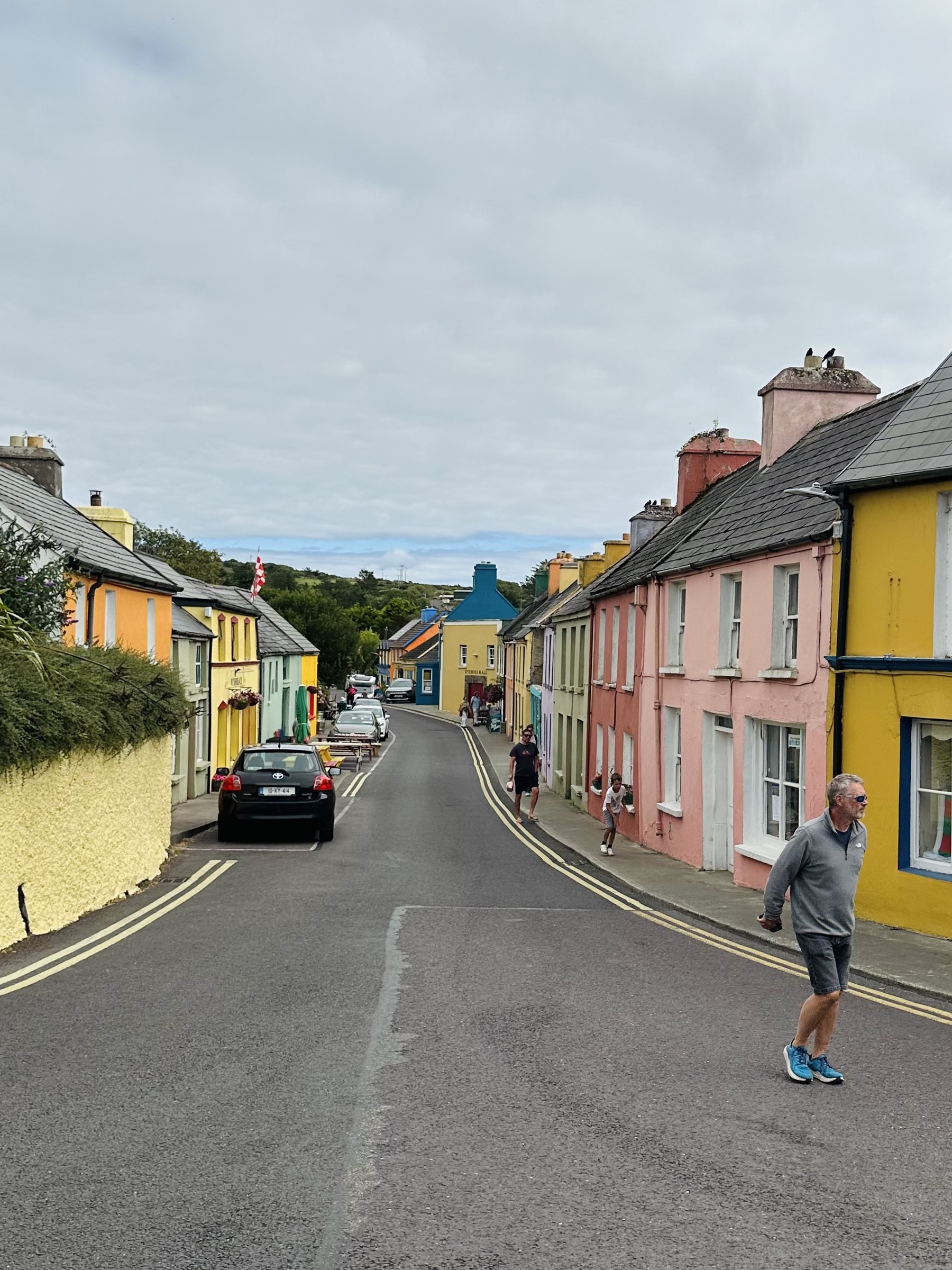 Brightly painted houses lining the main street through Eyeries