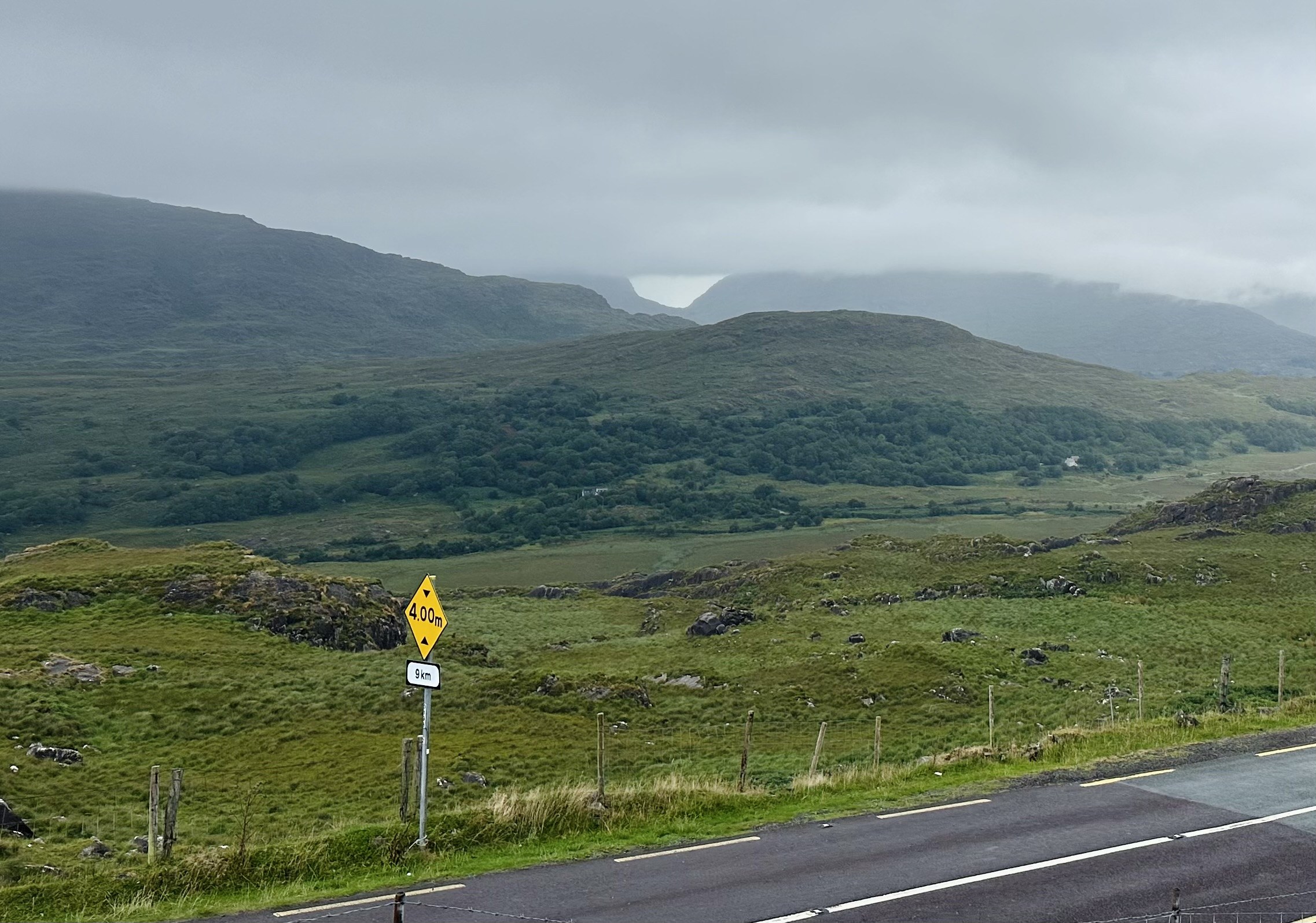 A misty mountain valley seen from the road between Kenmare and Muckross