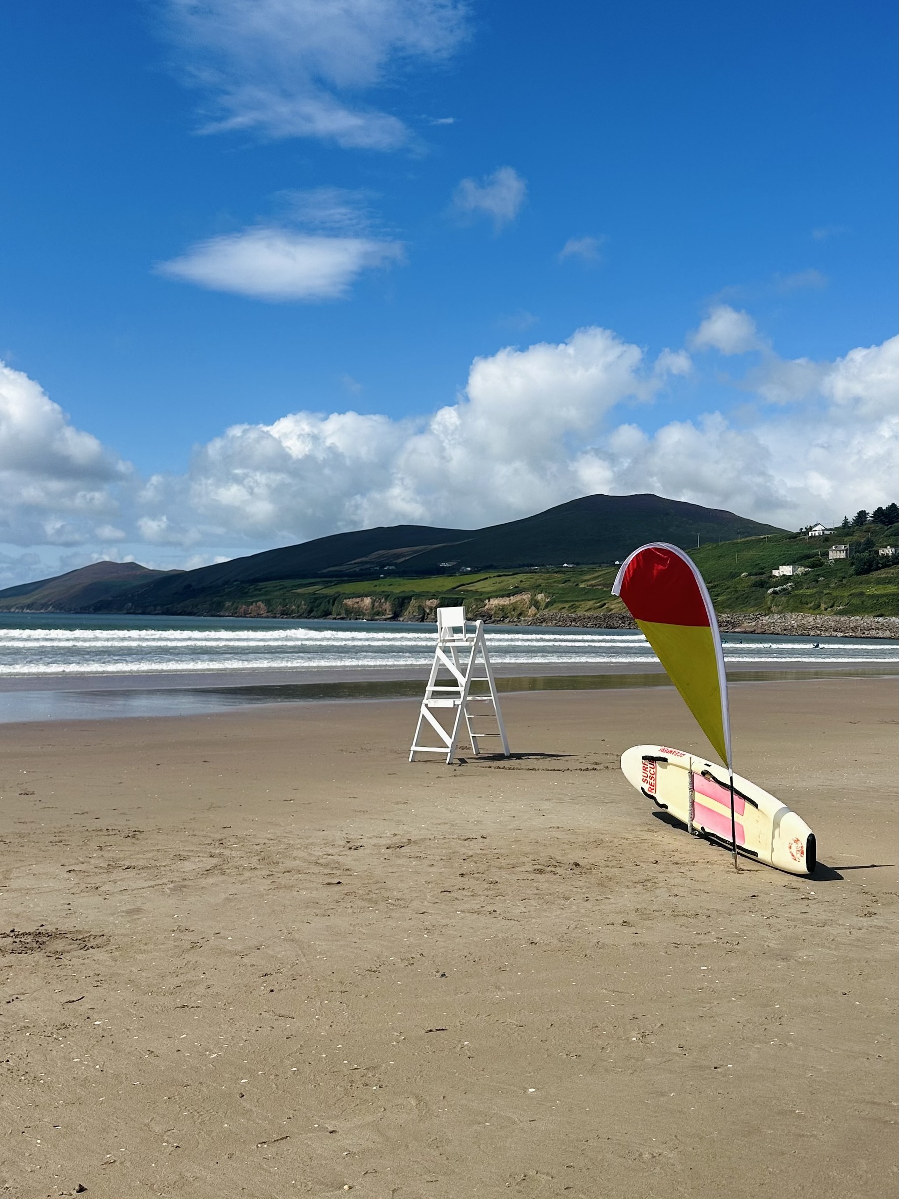 A lifeguard chair and rescue board standing on the sand at Inch Beach