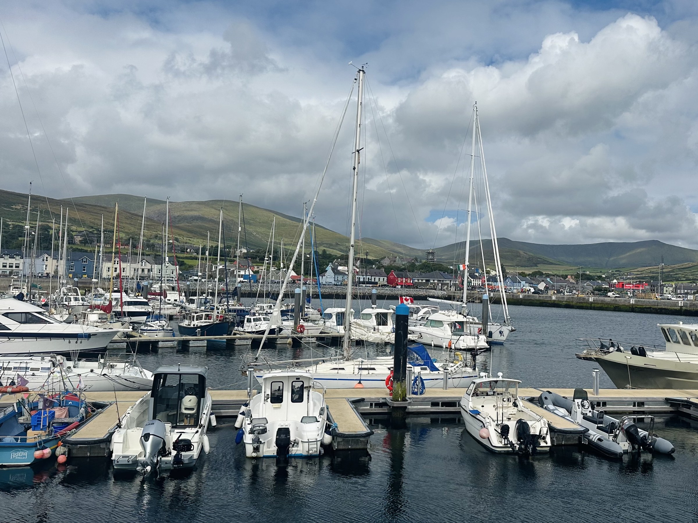 Sailing boats and fishing craft moored in Dingle Marina