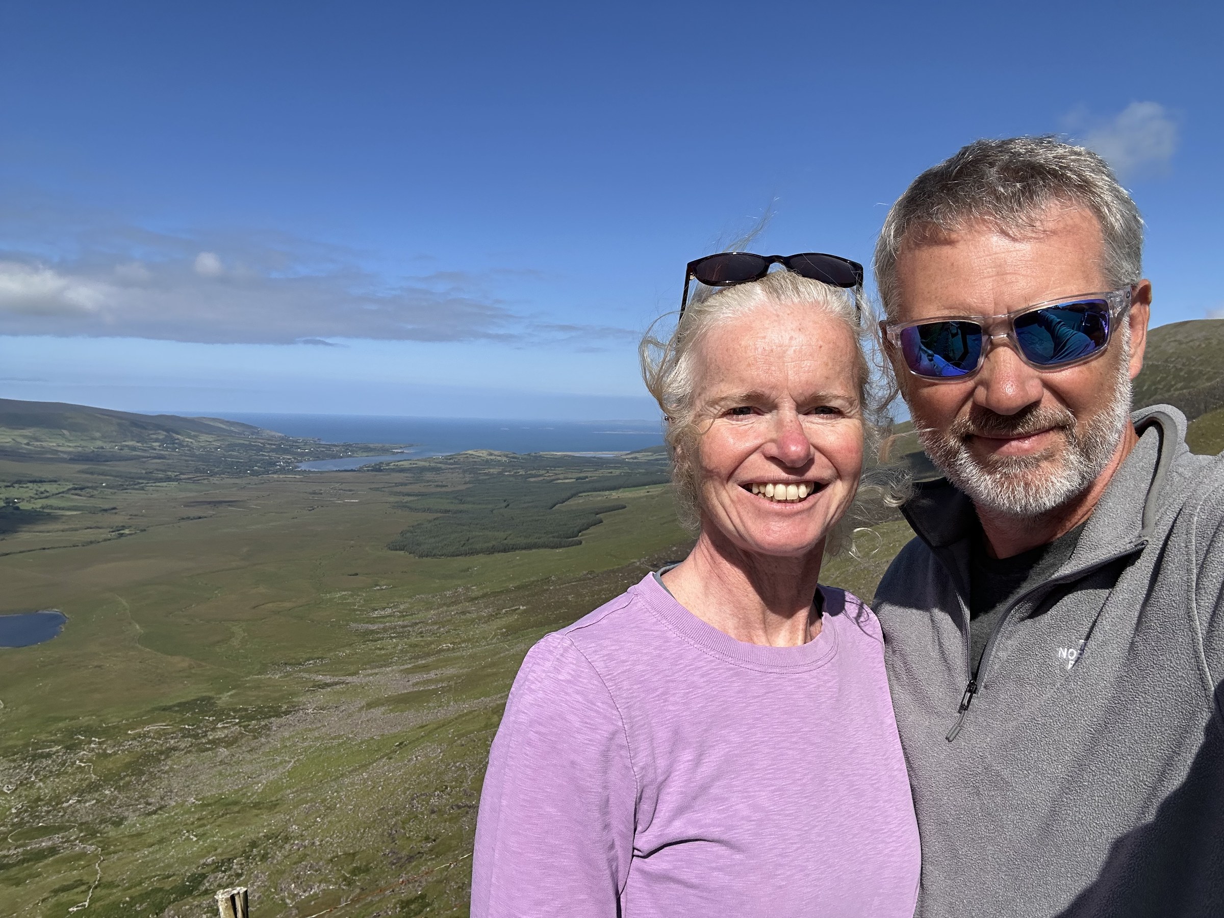 Sue and John at the Conor Pass viewpoint with the valley behind