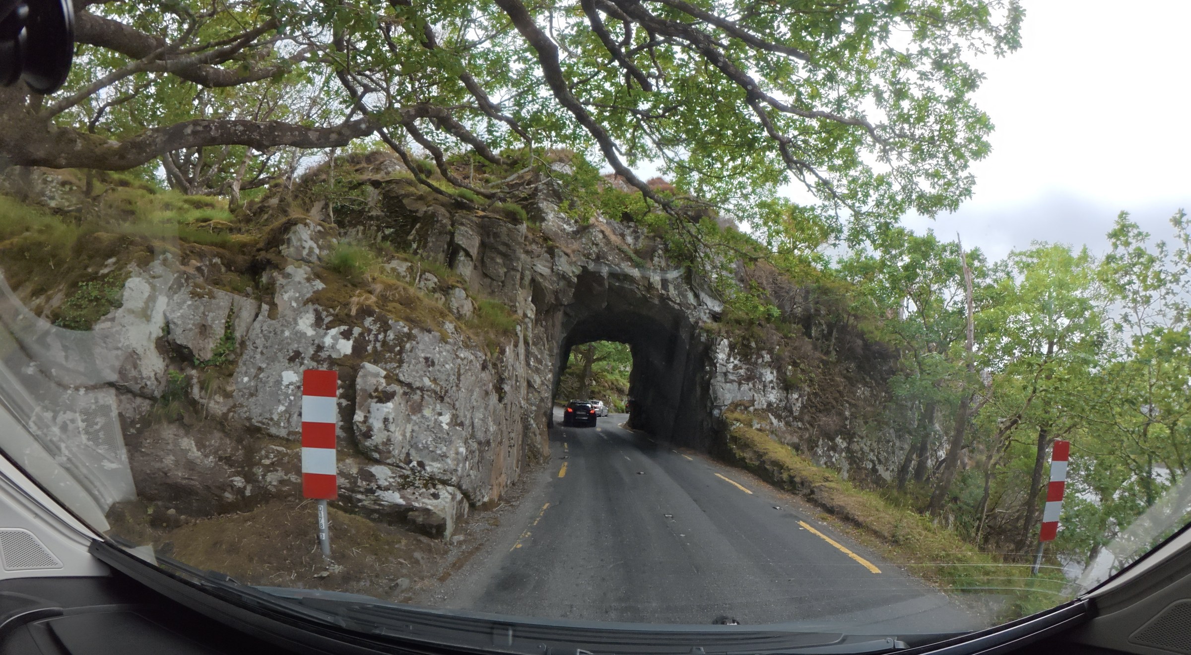 The N71 passing through a narrow, single-lane stone tunnel