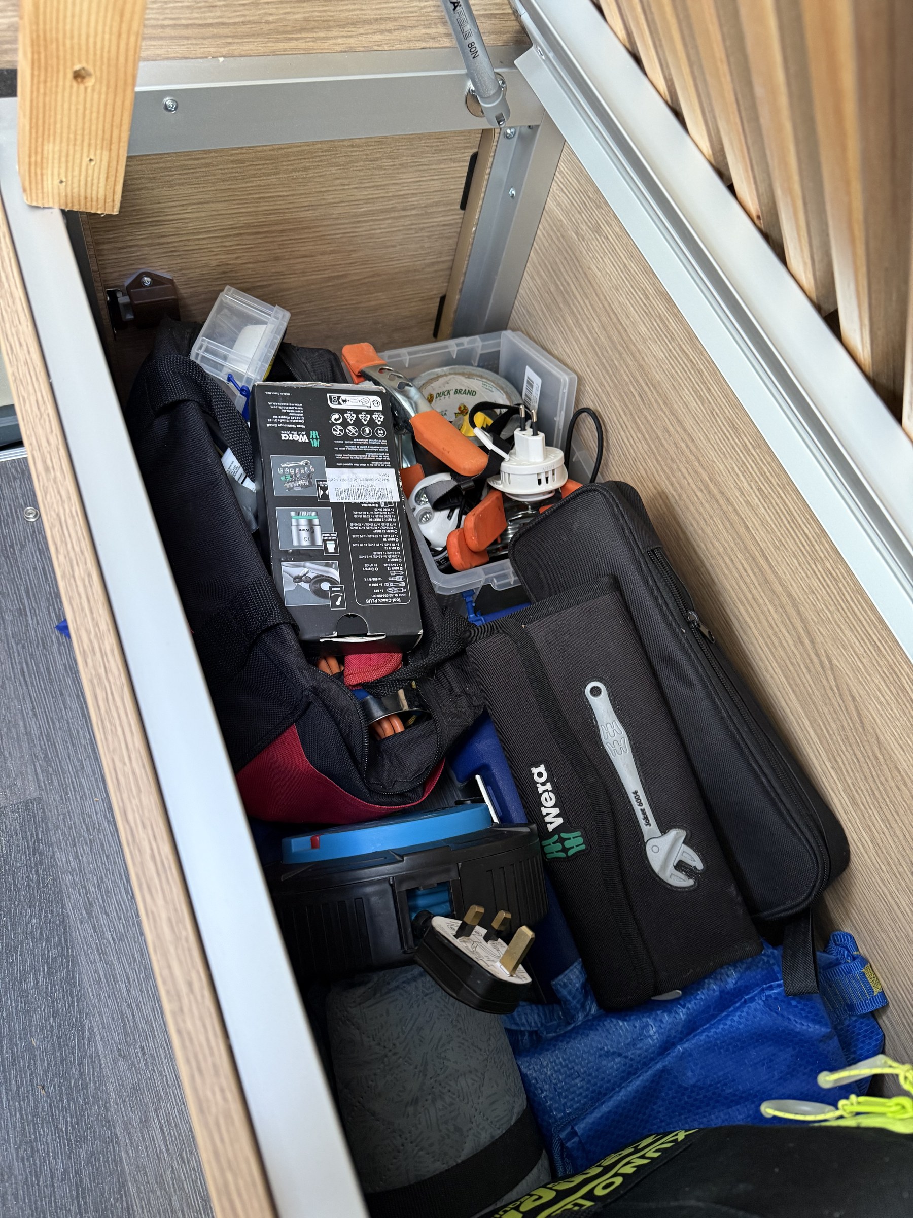 Screwdrivers, spanners and other tools stored in the passenger-side seat-bed pod