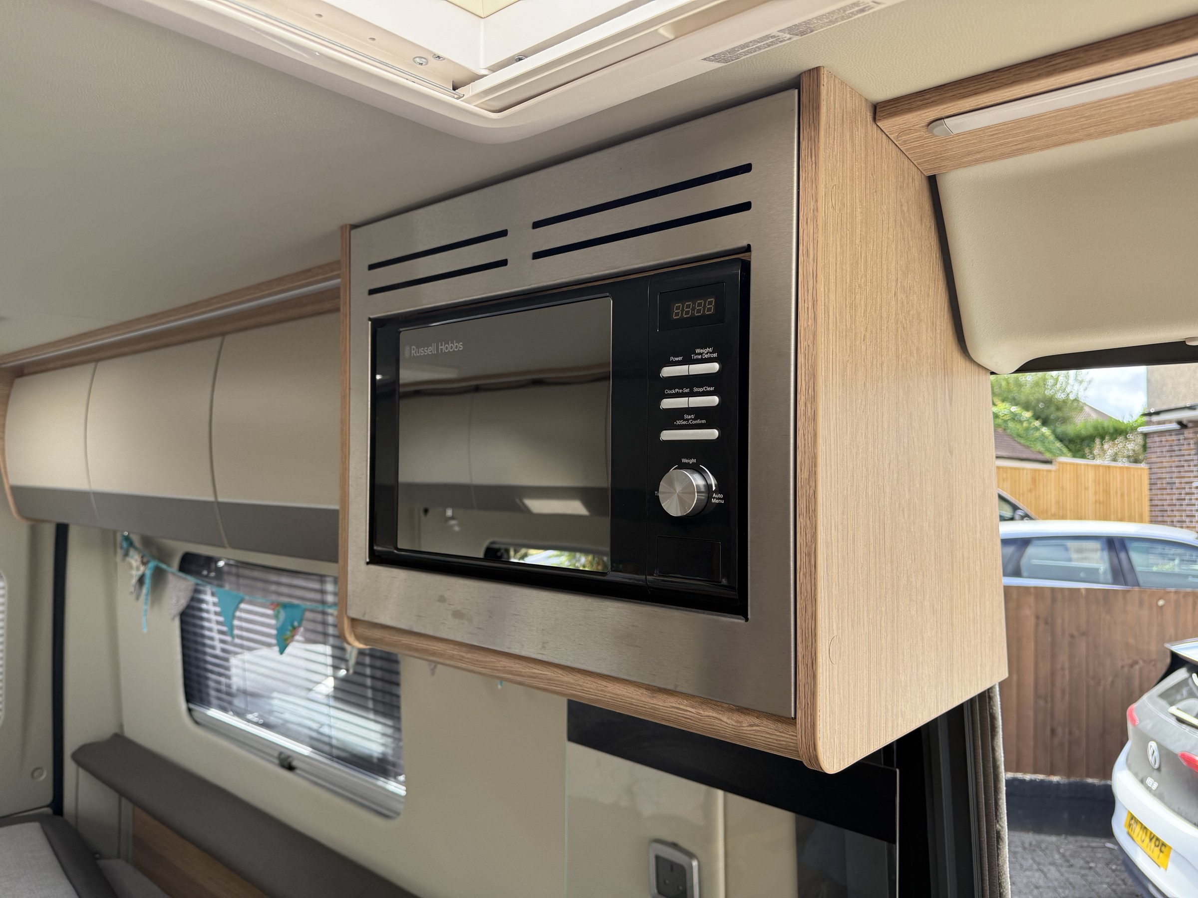 The microwave fitted above Ollie-II's kitchen
