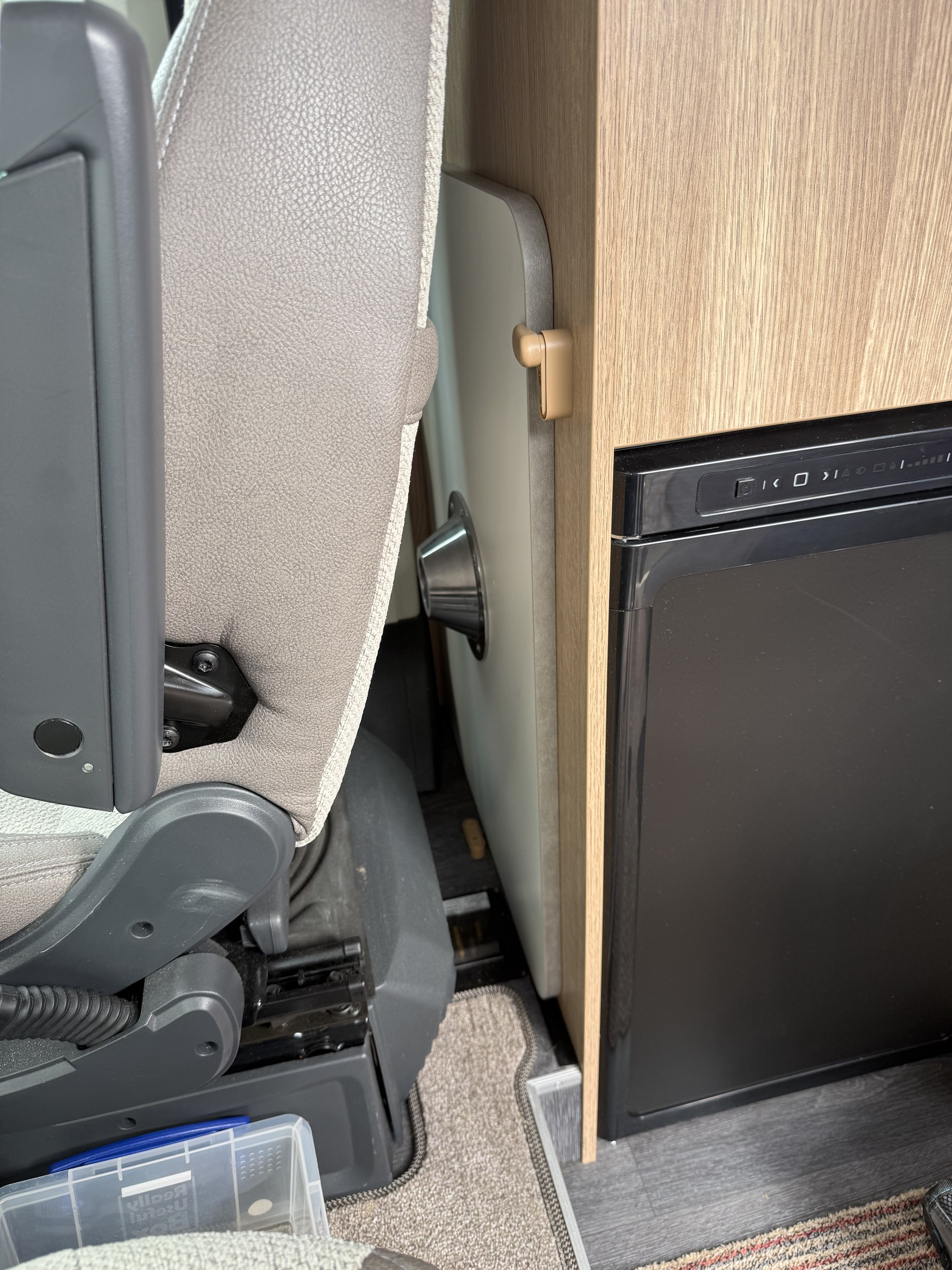 The indoor table top stored vertically behind the driver's seat