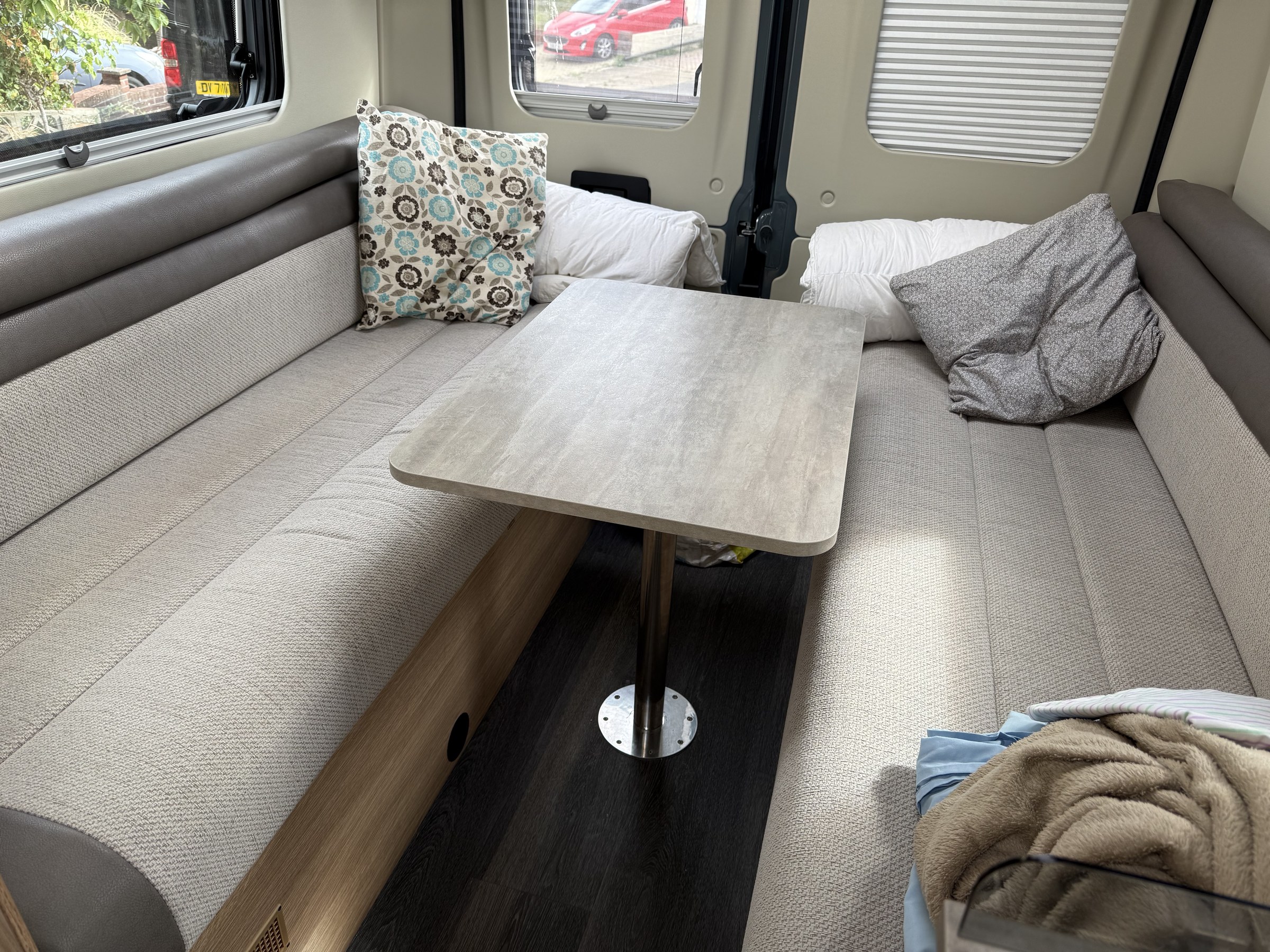 The indoor table set up between Ollie-II's bench seats