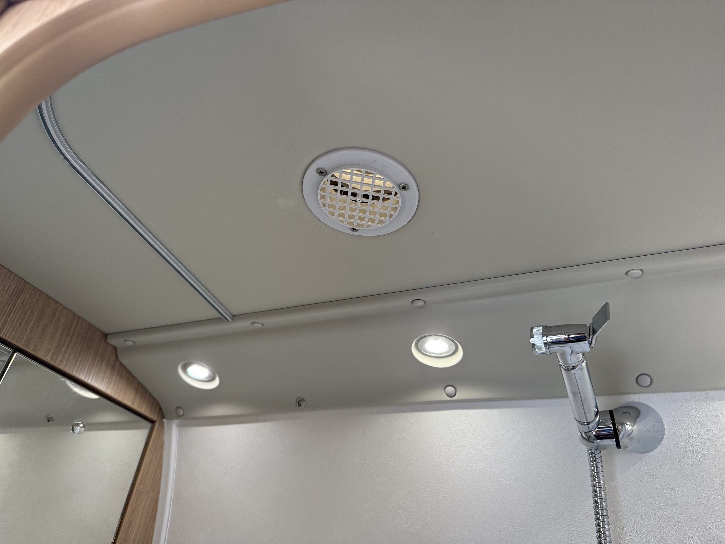 The small ventilation grille in the ceiling of Ollie-II's wet room
